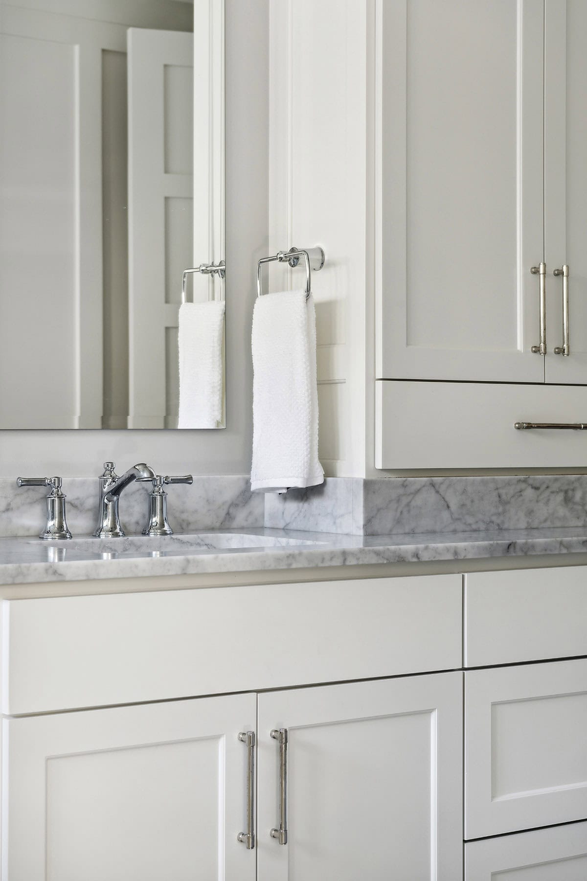 Close-up of vanity faucet and towel ring detail