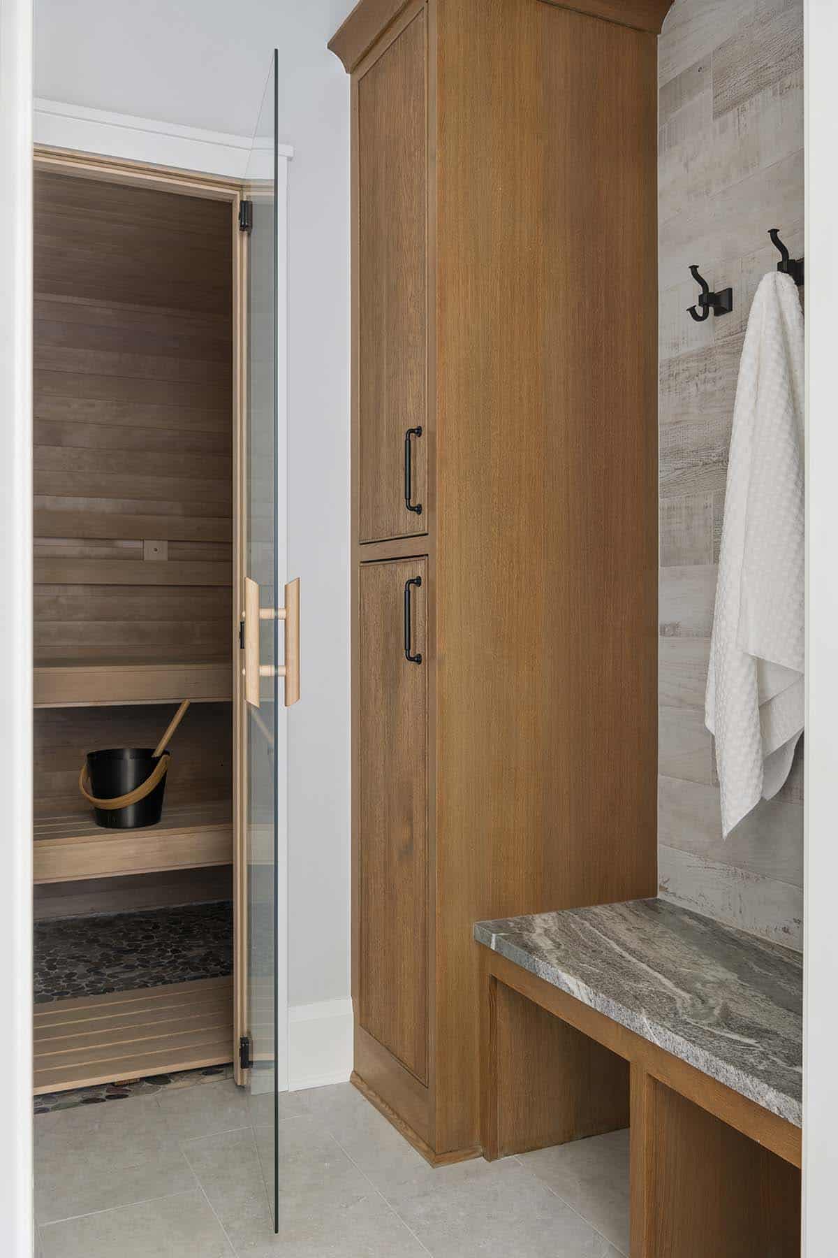 Cedar sauna door and built-in wardrobe with hanging towel