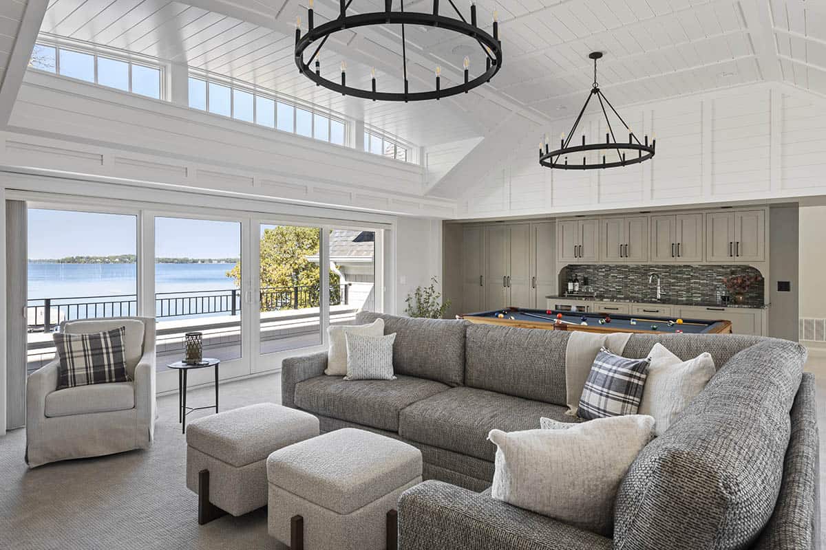 Family room with pool table, wet bar, and lake-view doors