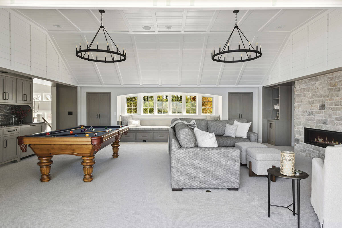 Pool table and window seat in vaulted family room