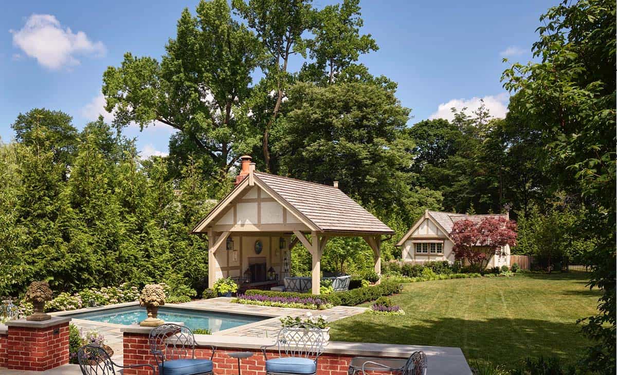 Poolside pavilion and guest cottage surrounded by mature trees and gardens