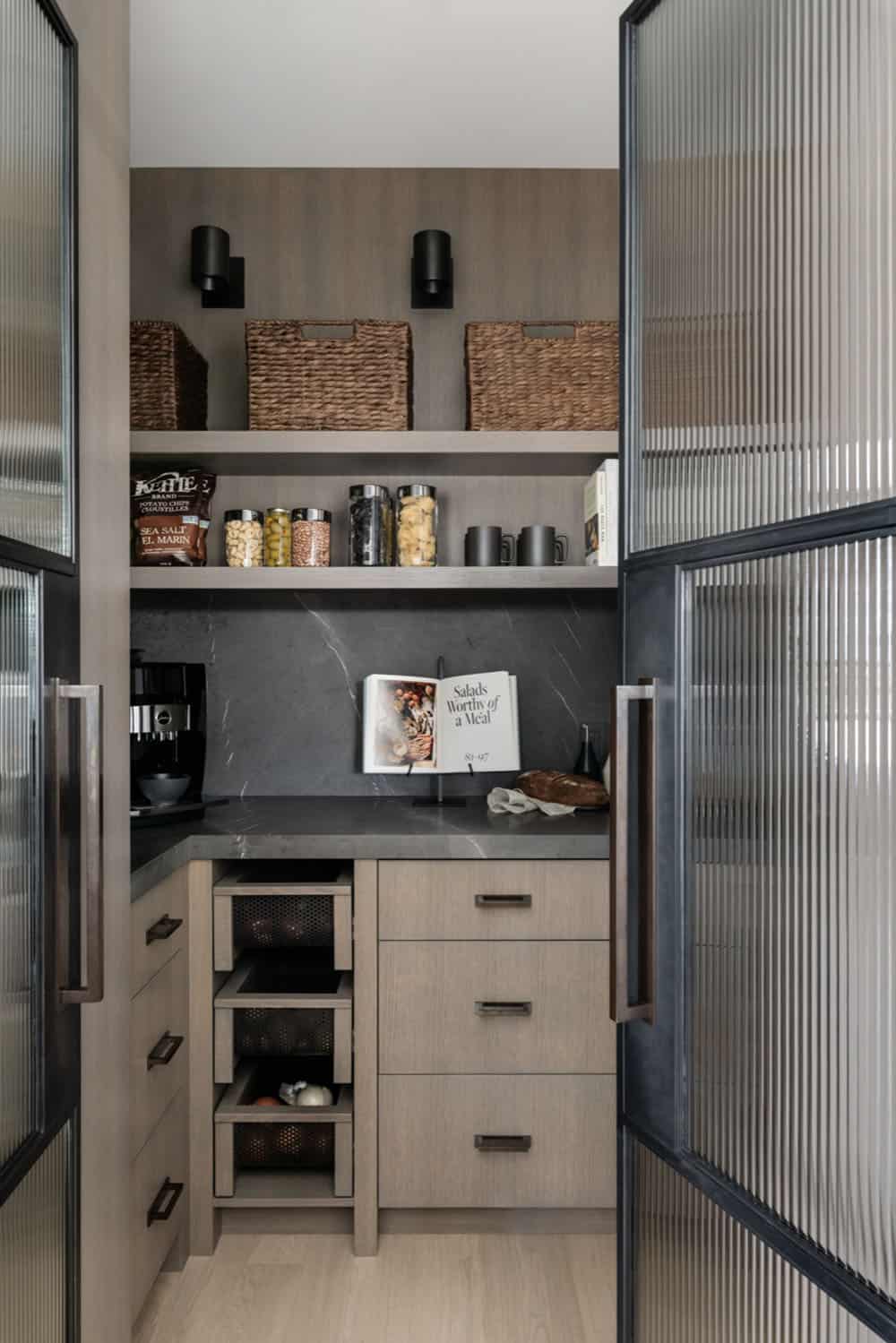 Butler's pantry with woven baskets, open shelving, and espresso machine