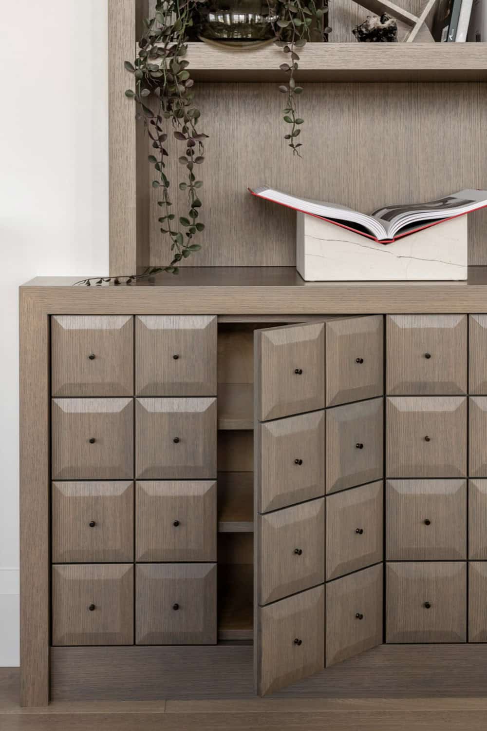 Sculptural cabinet drawers with open door detail