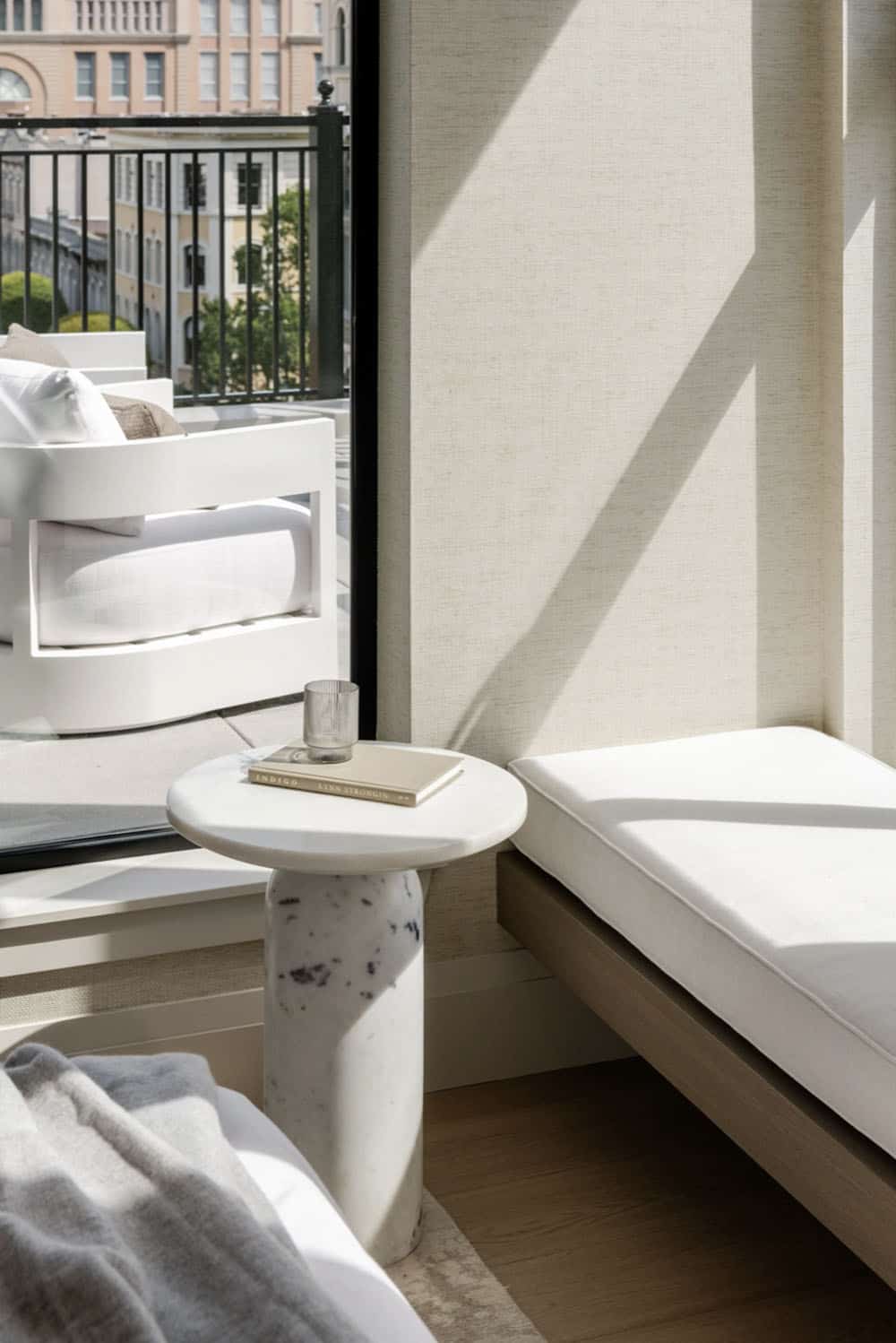 Marble side table on outdoor terrace with city views