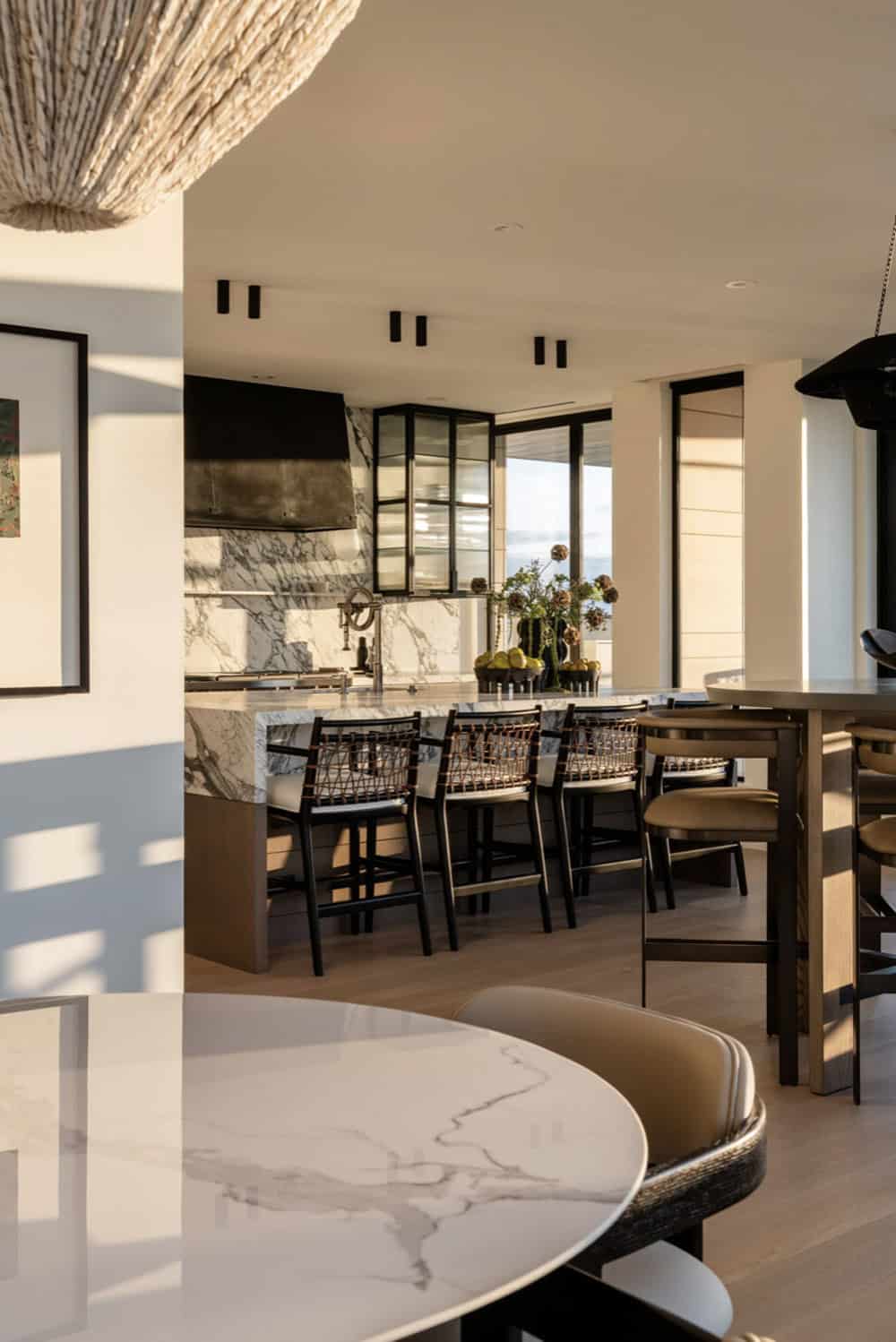 Dining area overlooking kitchen island with harbour views