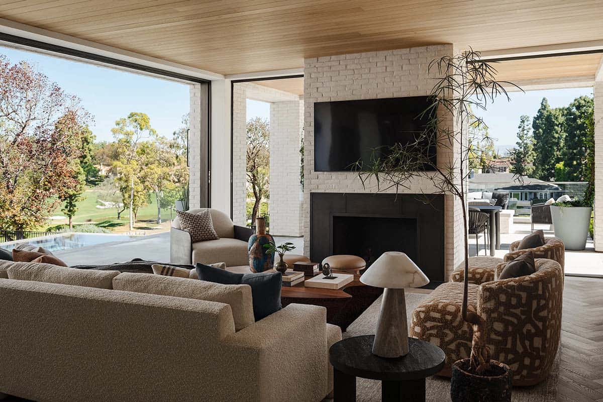 Open concept living room with disappearing walls to outdoor patio