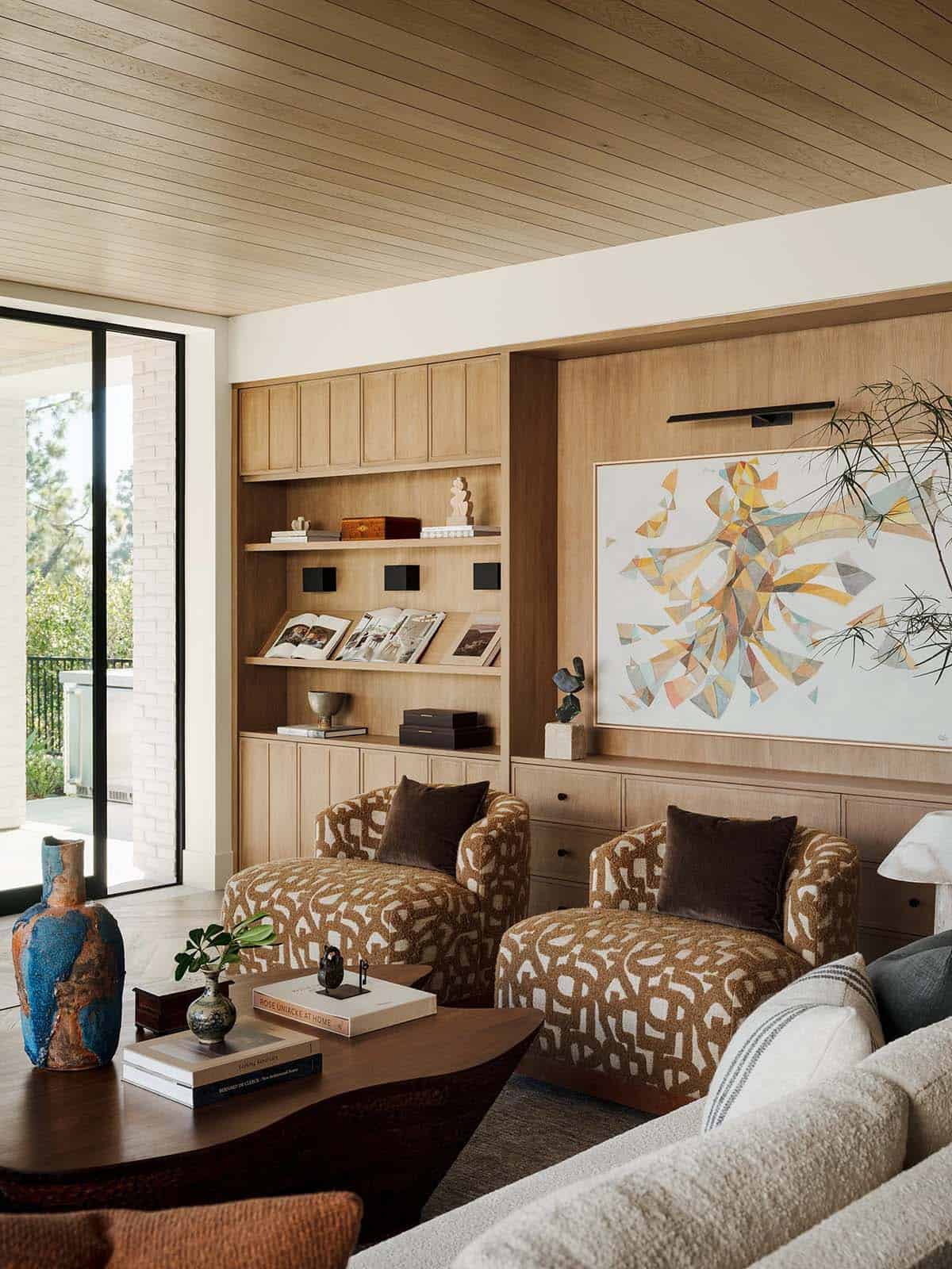 Modern living room with fireplace and floor to ceiling windows