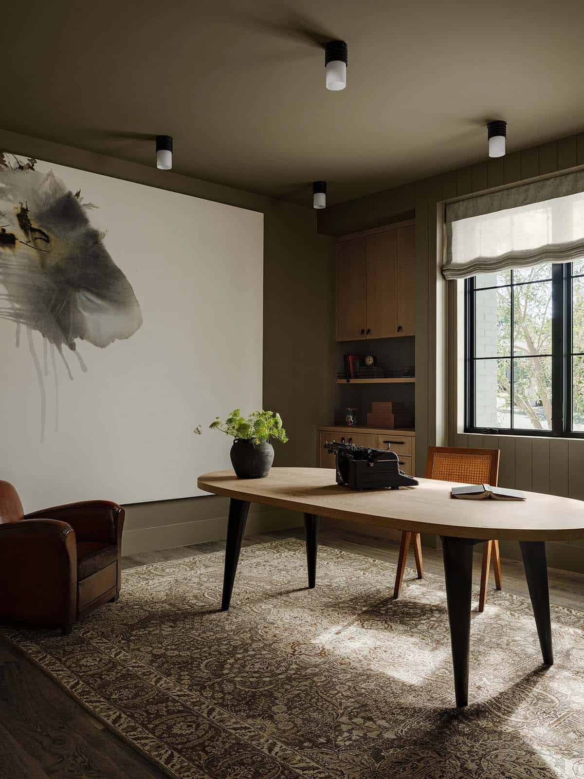 Home office with built in shelving and clean modern lines