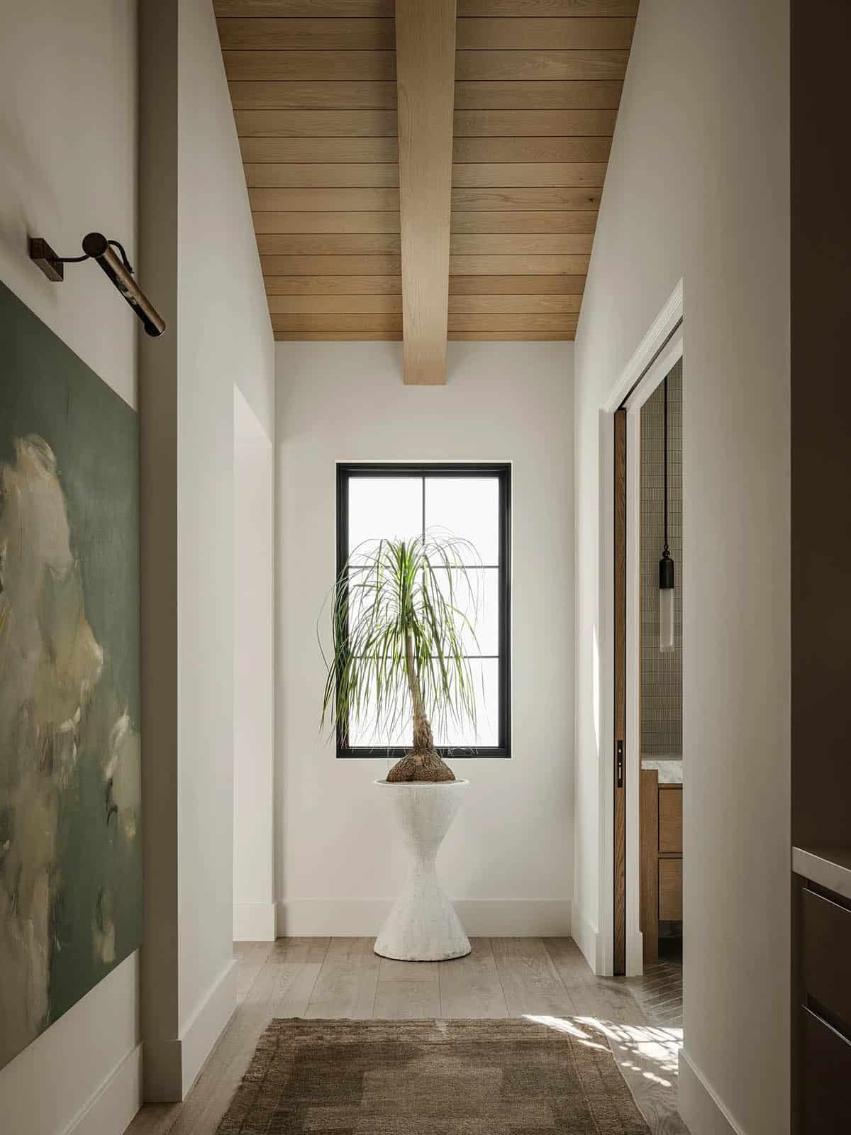 Primary bedroom hallway leading into the bathroom