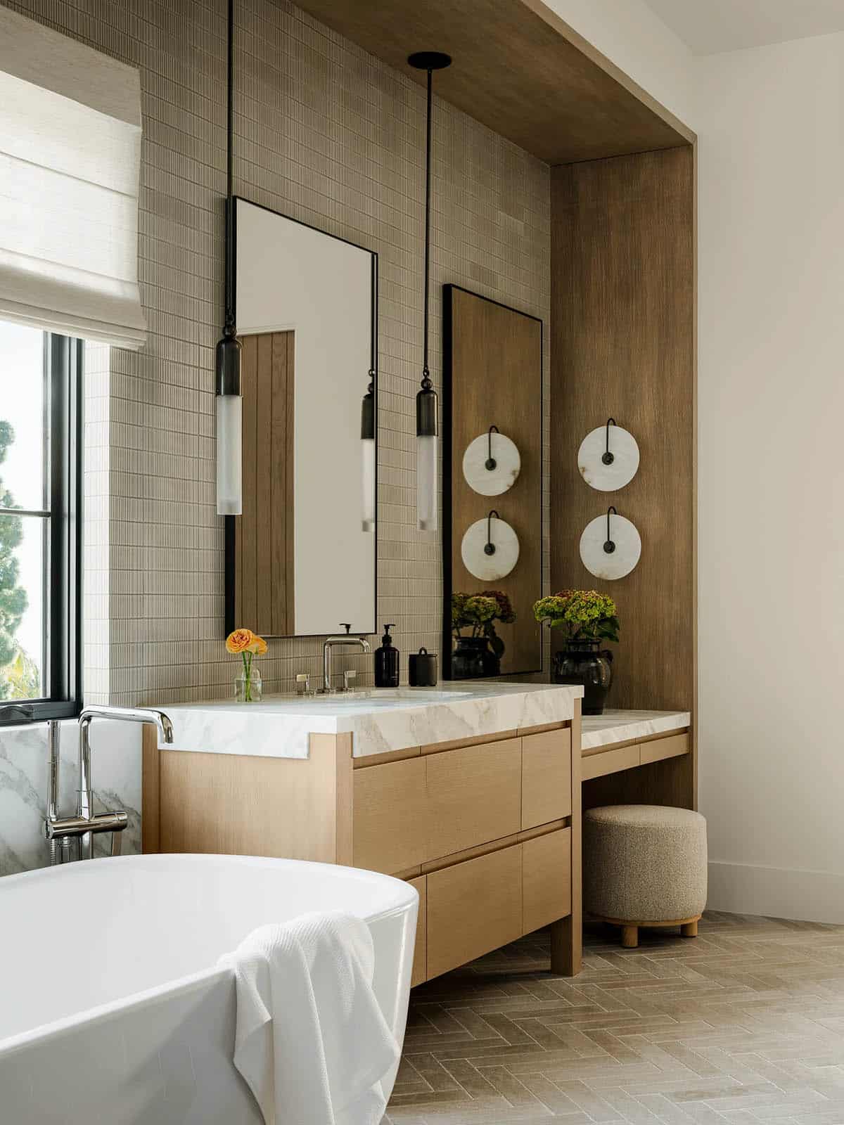 Primary bathroom with soaking tub and vanity with a makeup vanity