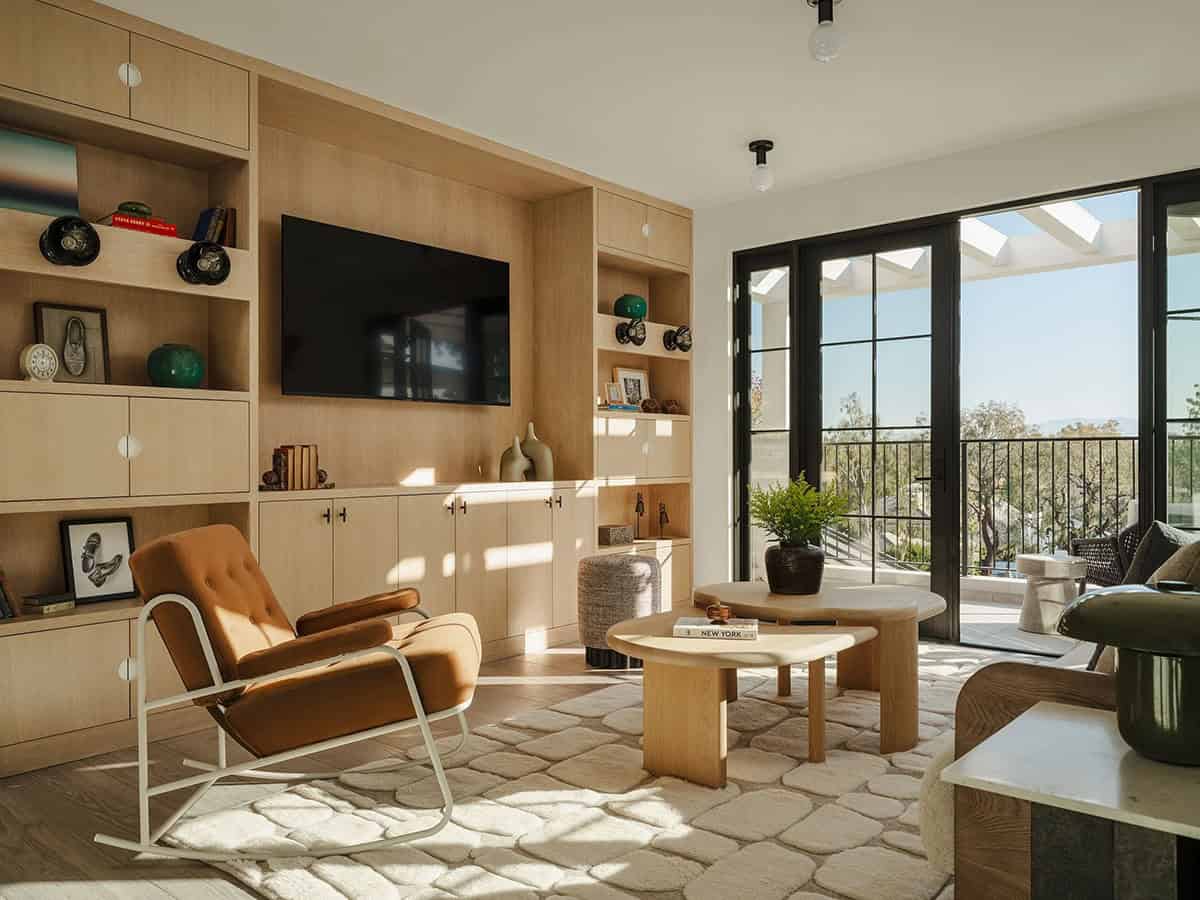 Media room with plush seating and built in entertainment center