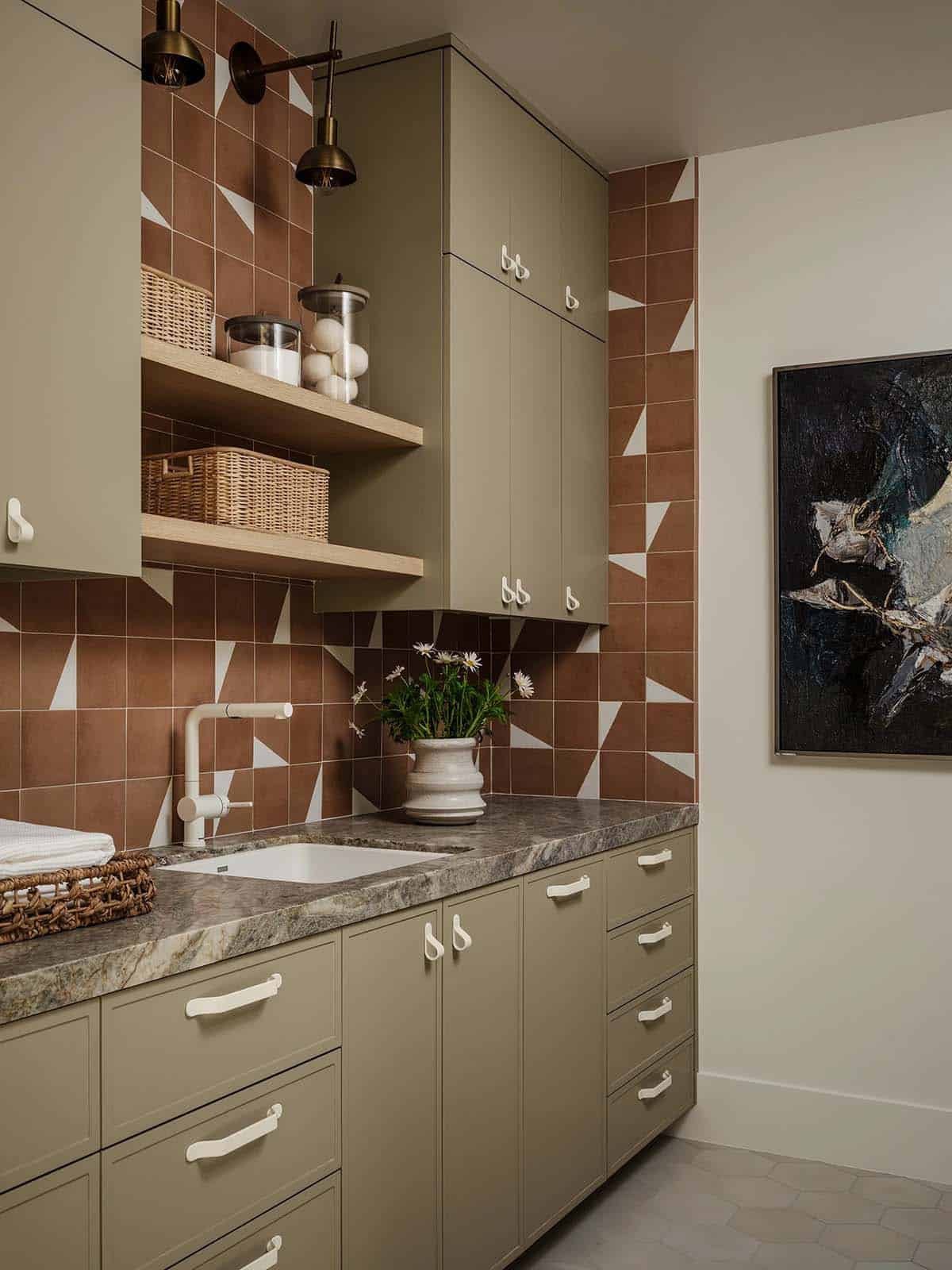 Laundry room with custom cabinetry and open shelving