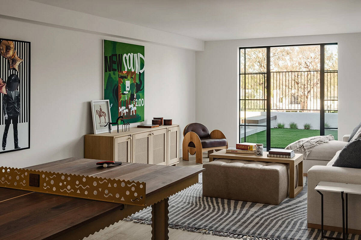 Game room with modern furnishings and custom ping pong table