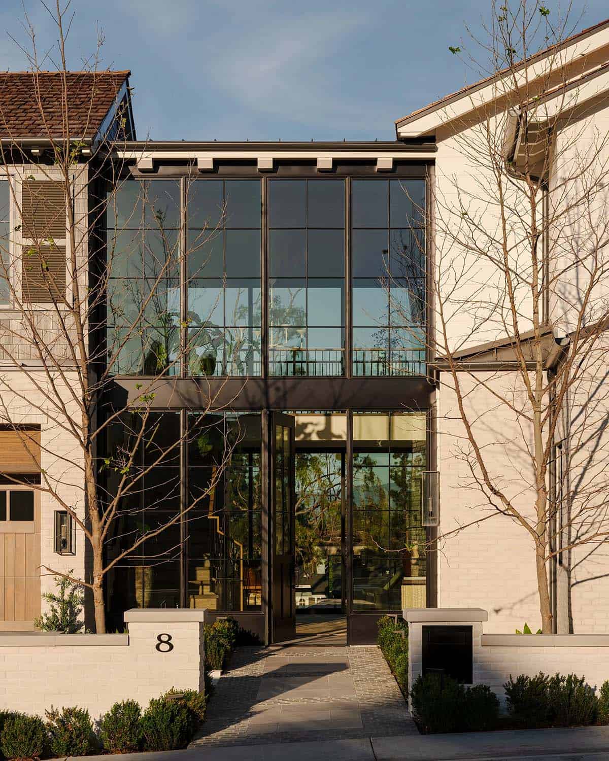 Front facade with glass entry and geometric architectural design