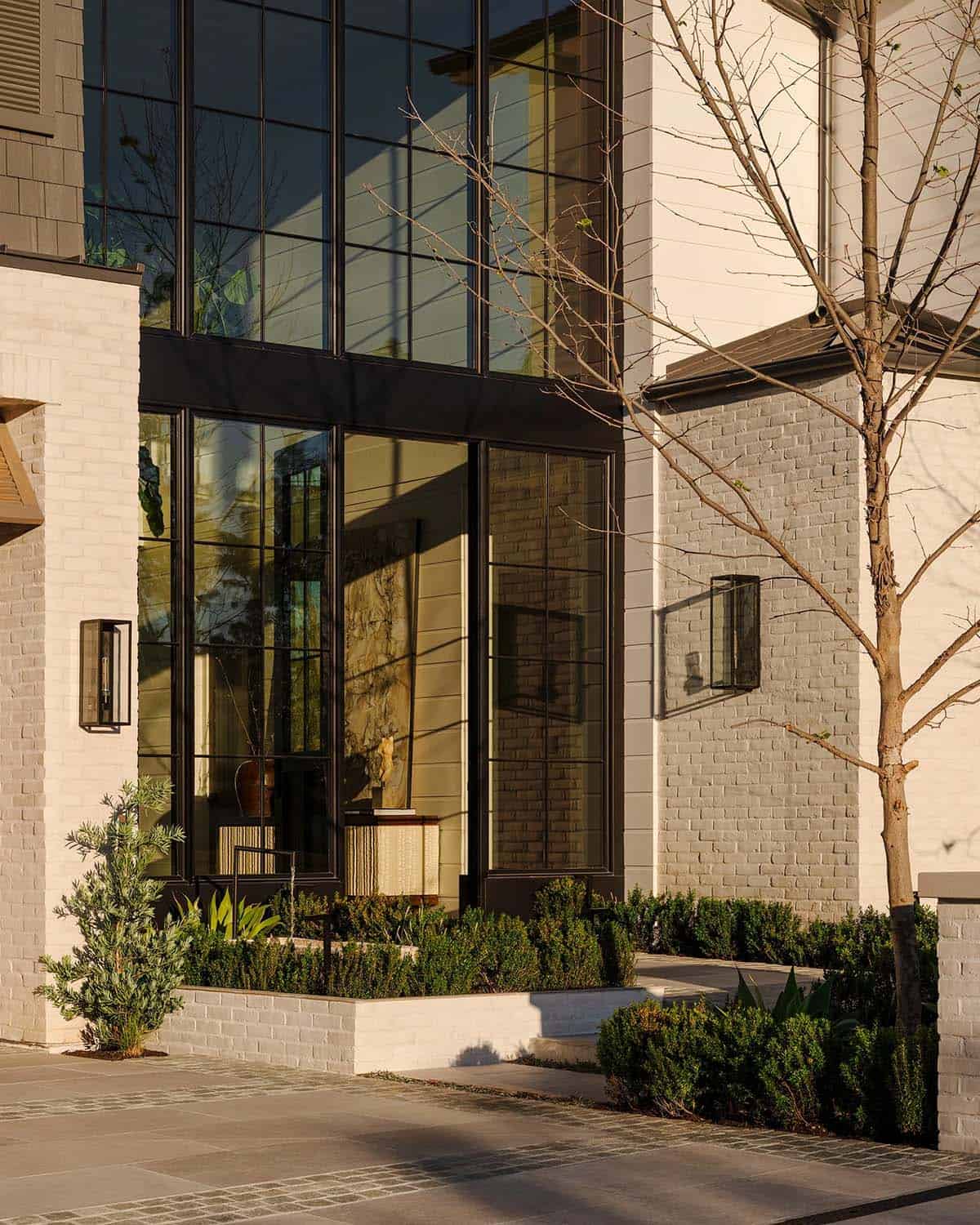 Exterior front view of modern home entry with walkway and landscaping