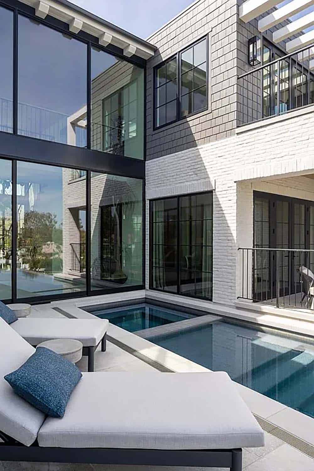 contemporary home patio with a swimming pool and hot tub