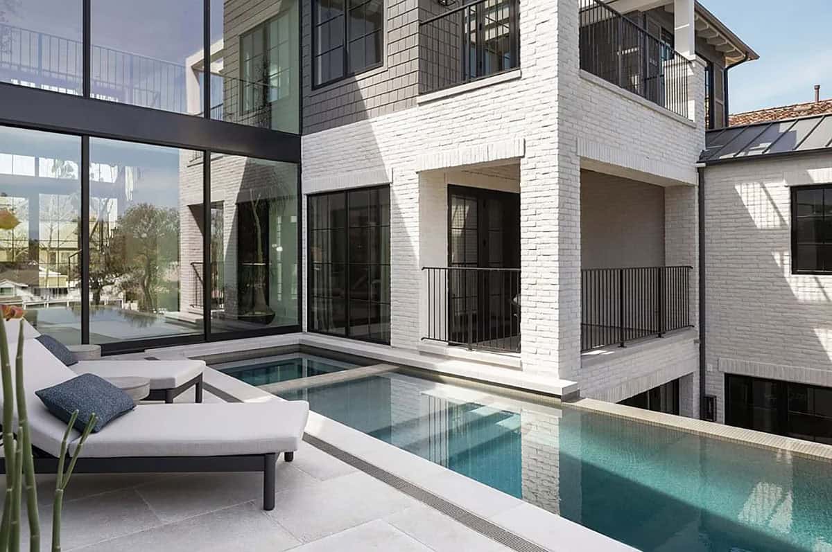 contemporary home backyard patio with a swimming pool and spa