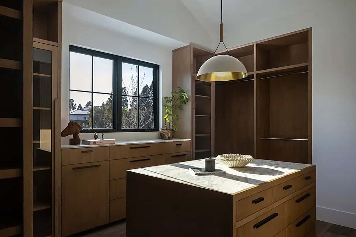 primary bedroom suite with a walk-in closet