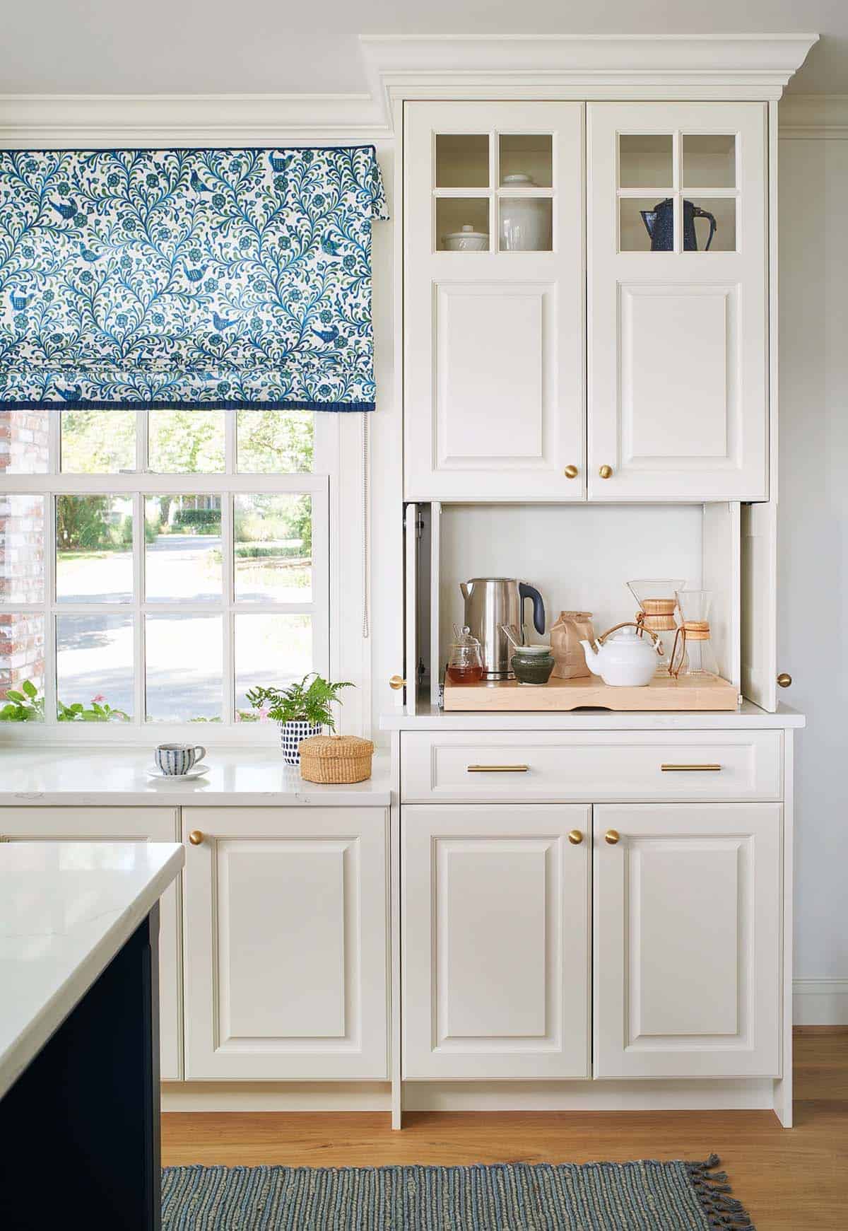 Kitchen coffee and tea station with floral Roman shade