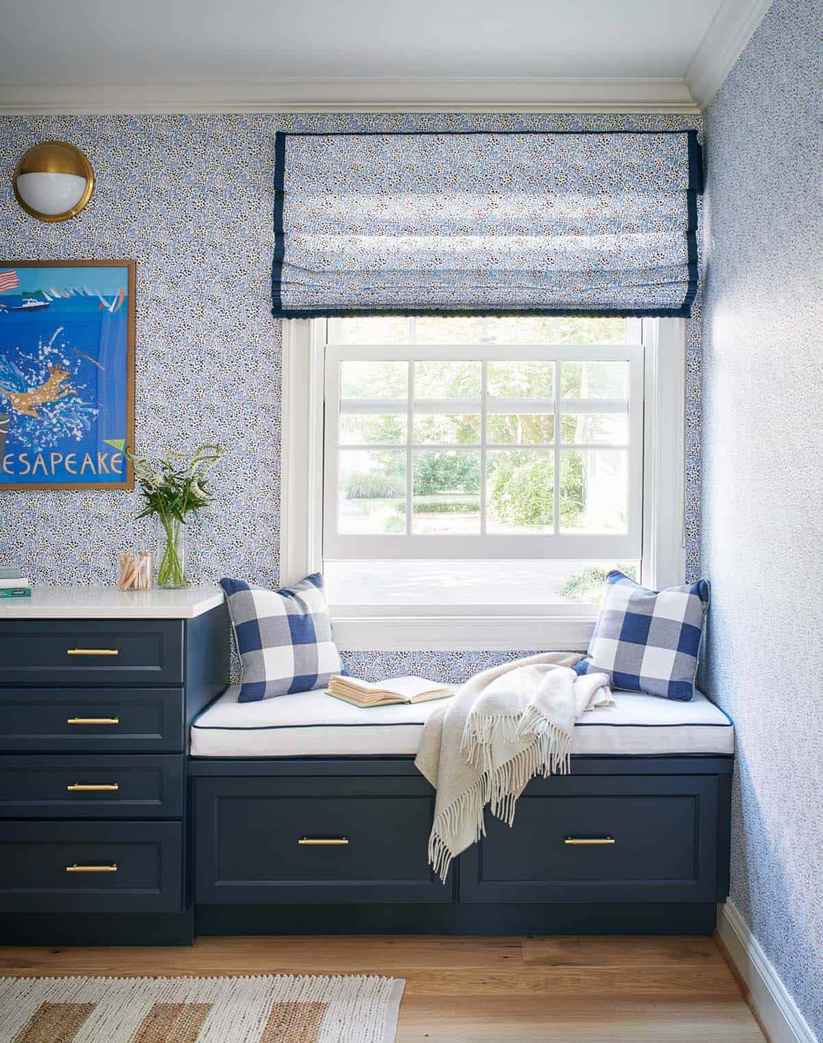 Window seat nook in navy and blue floral laundry room