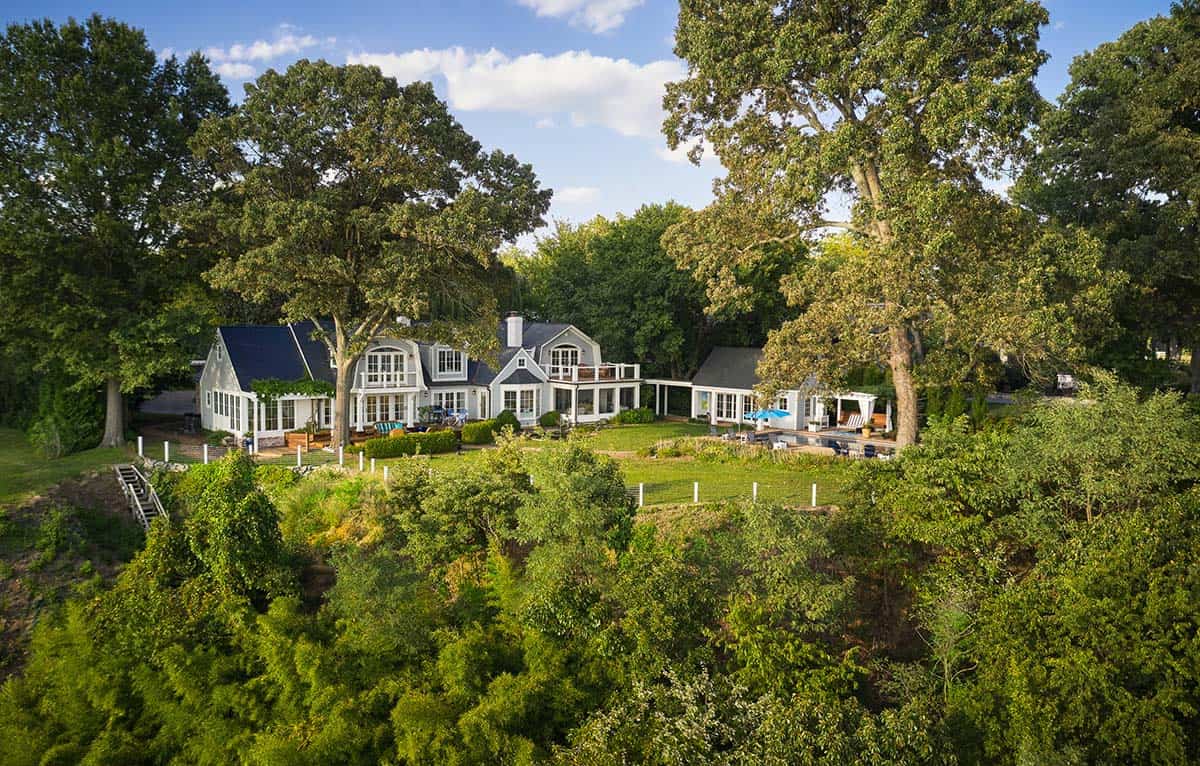 Aerial view of the beach-style home surrounded by trees along the Severn River