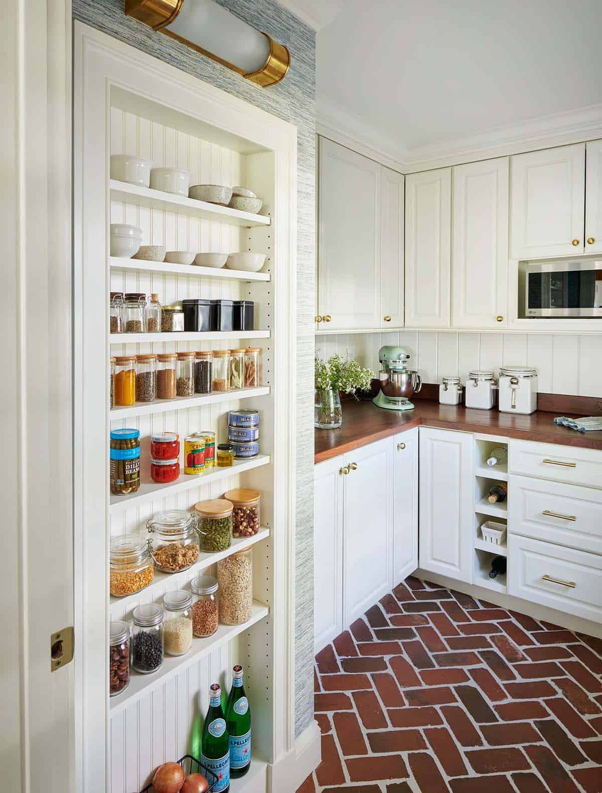 Butler's pantry shelving stocked with dishes and pantry staples