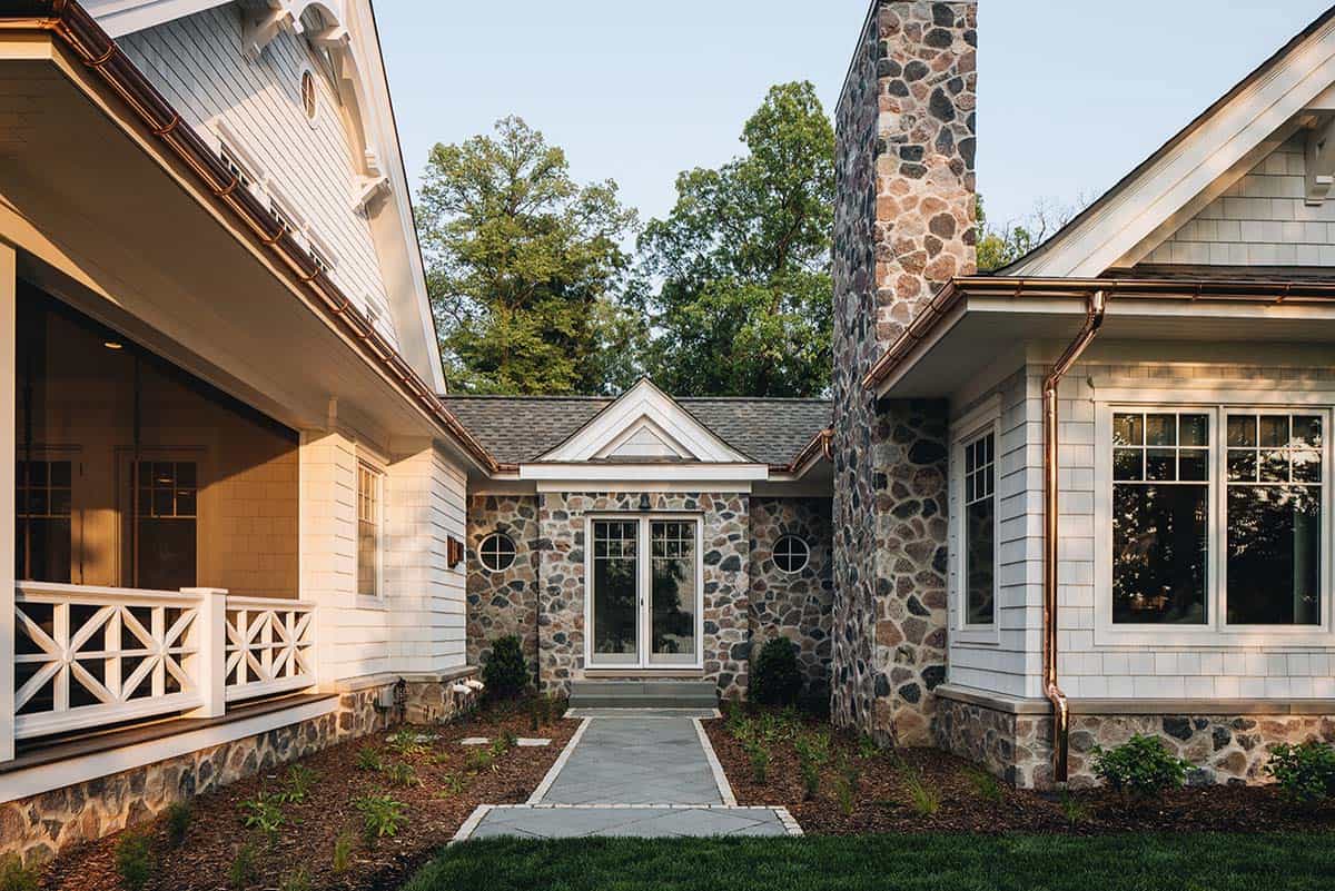 Stone breezeway connecting two wings of the house with French doors