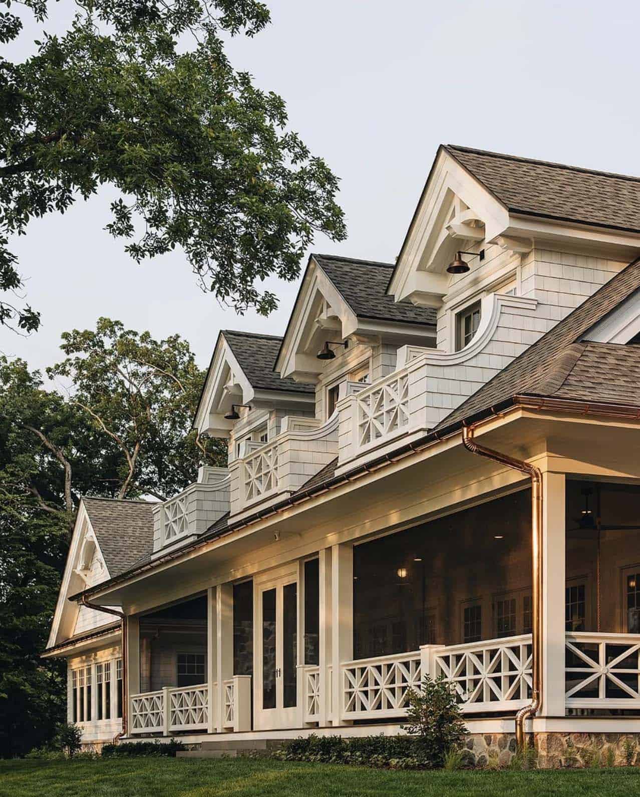 Close-up of matching dormers along wraparound screened porch roofline