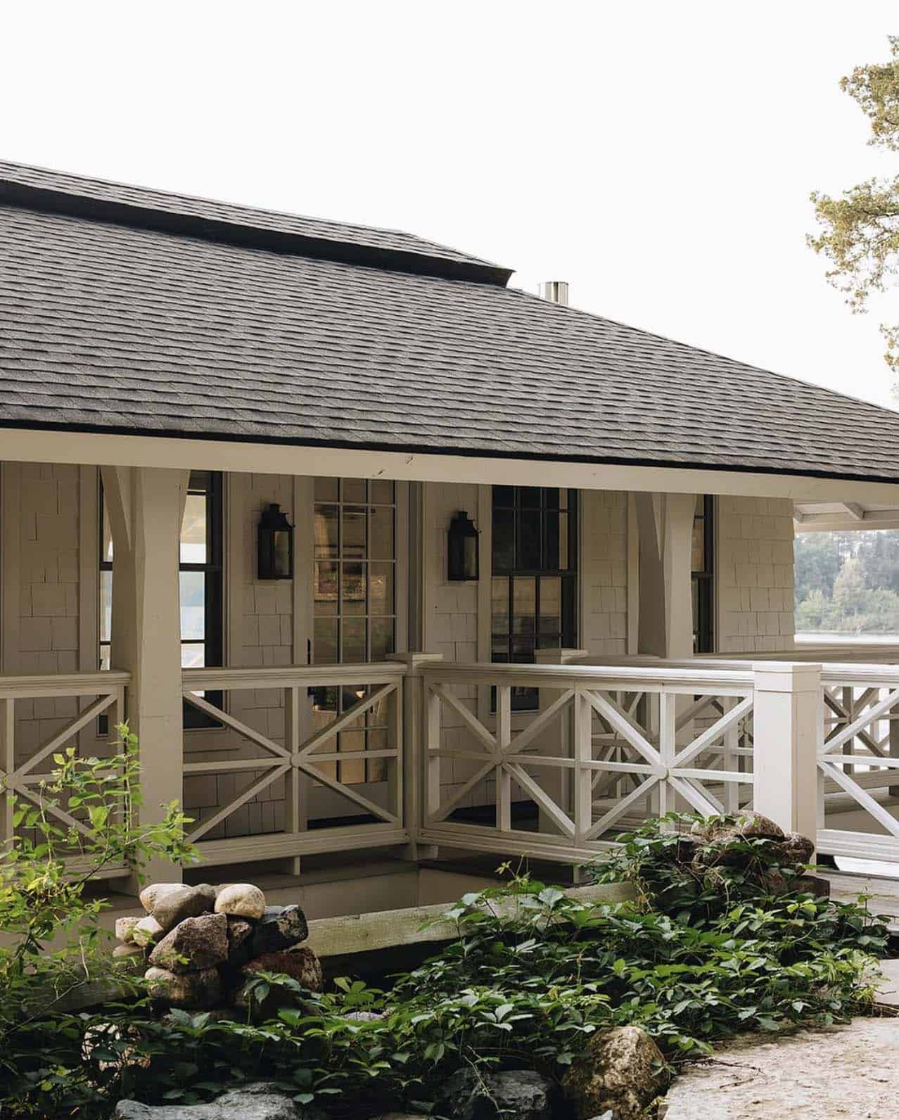 Corner porch detail with cross railings overlooking the lake