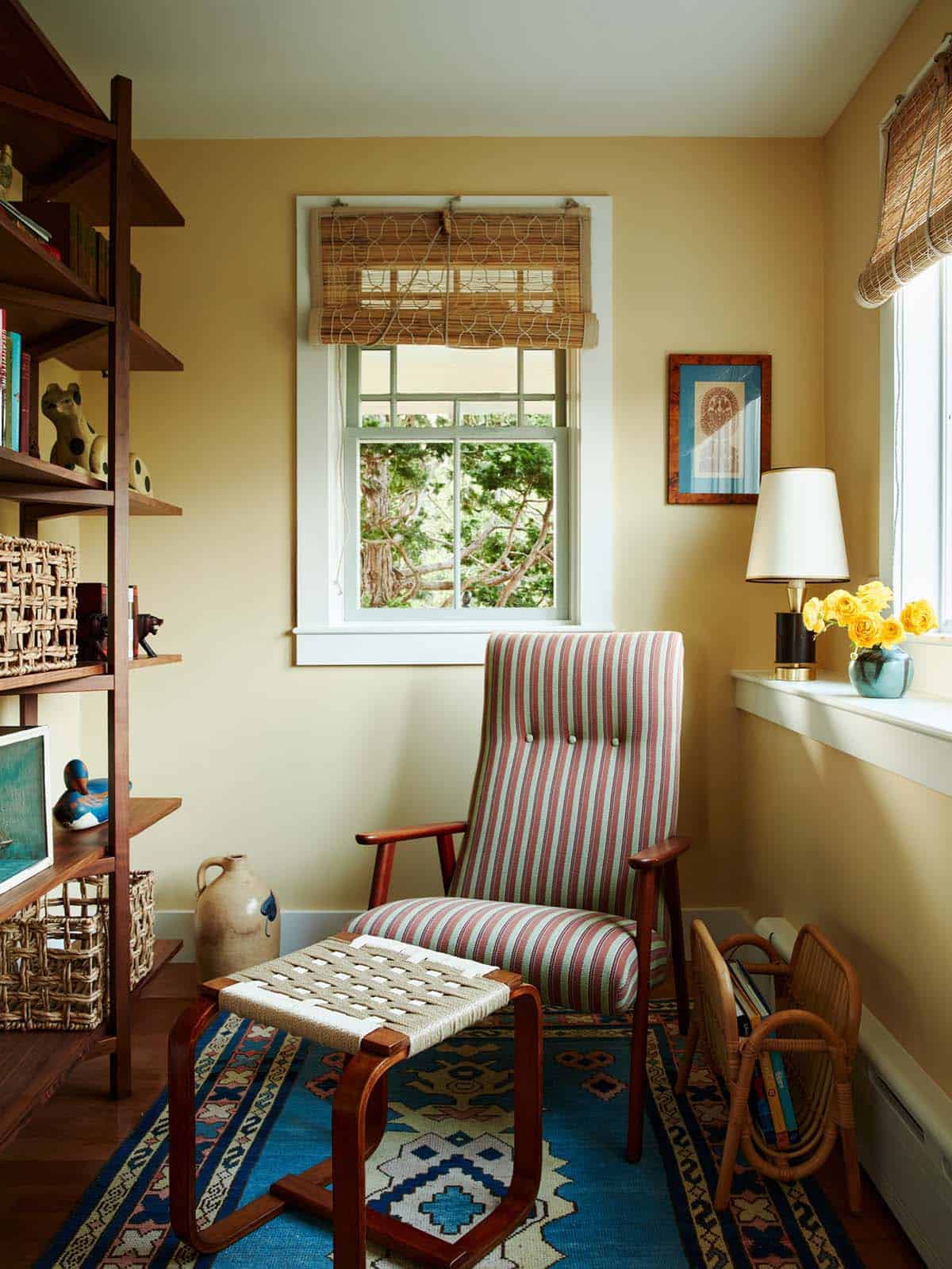 Reading corner with striped chair and blue kilim rug
