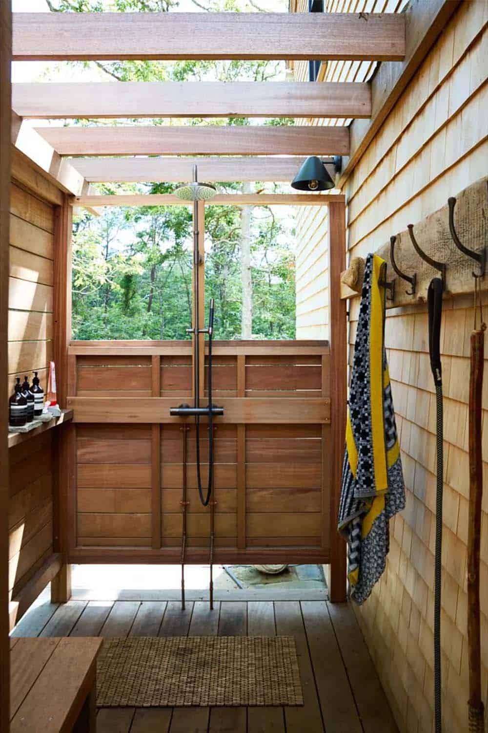 Outdoor shower with cedar shingle walls and rainfall showerhead