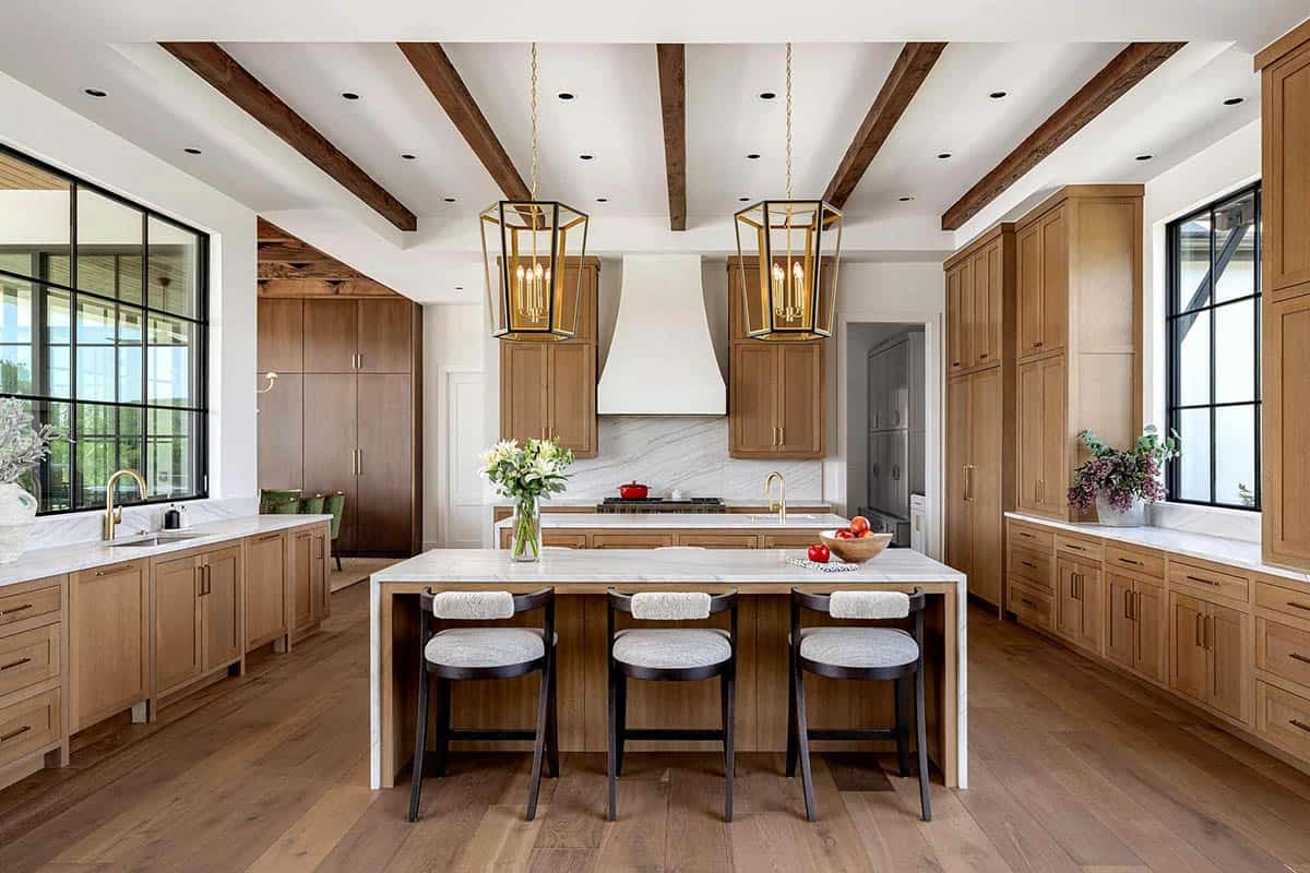 Kitchen with wood beam ceiling and brass lantern pendant lights