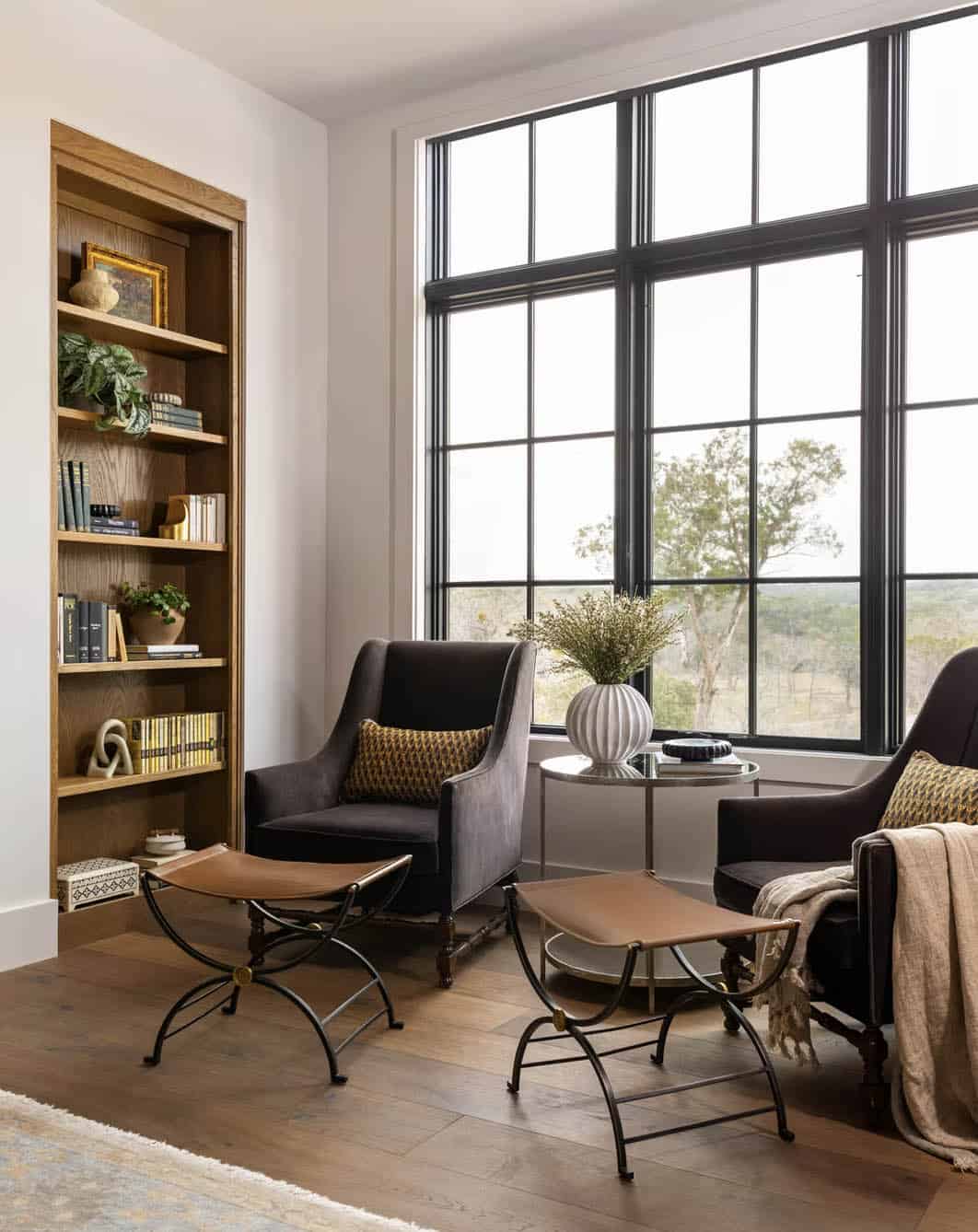 Reading nook with built-in bookshelf and leather saddle stools