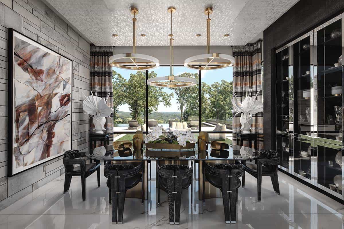 Dining room with round brass pendants and black sculptural wood chairs