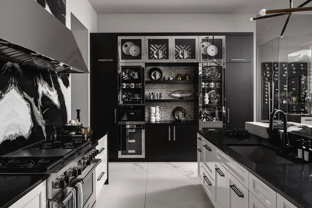 Black and white kitchen display cabinet with marble backsplash detail