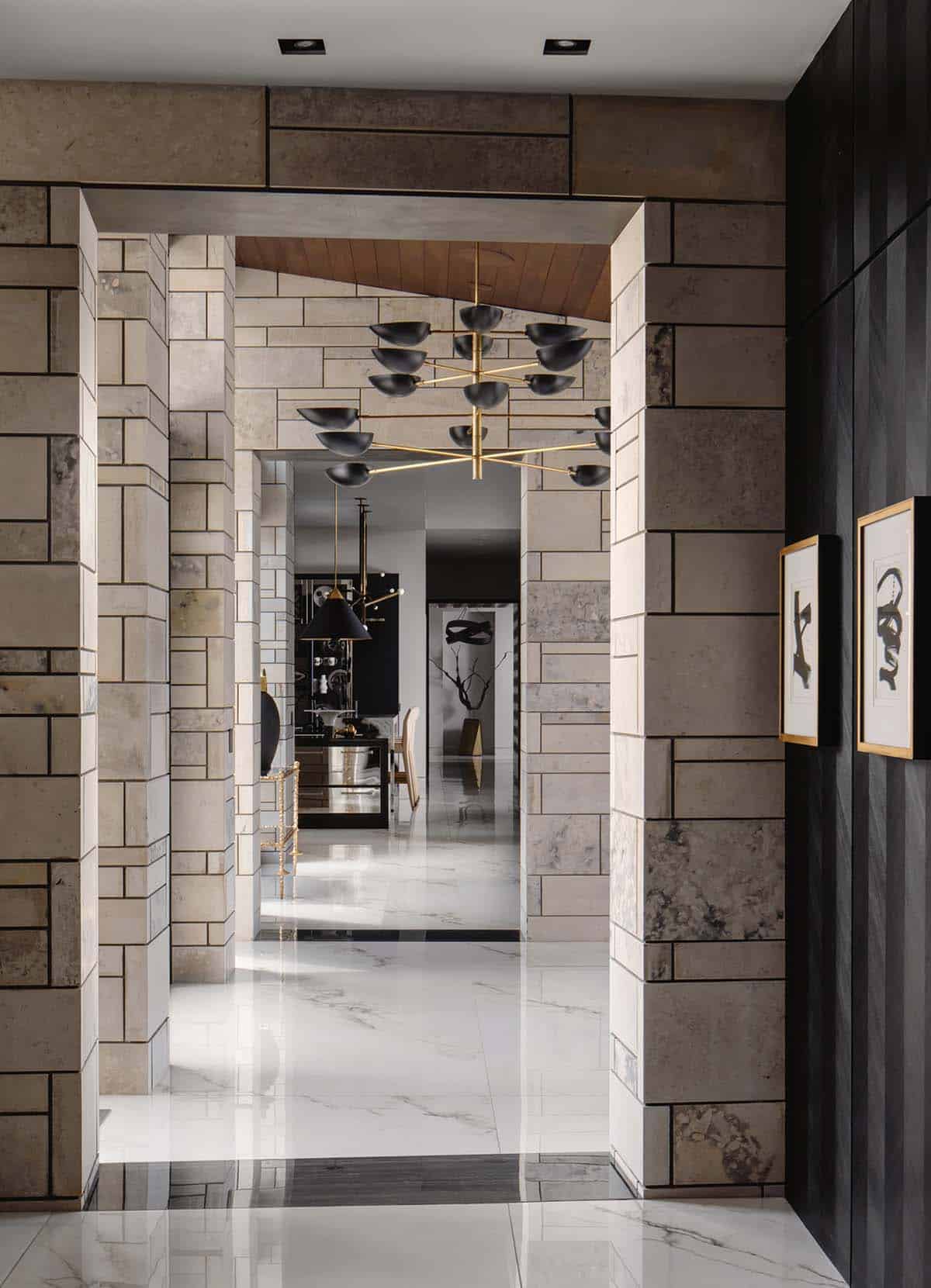 Stone archway hallway leading toward the kitchen and dining spaces