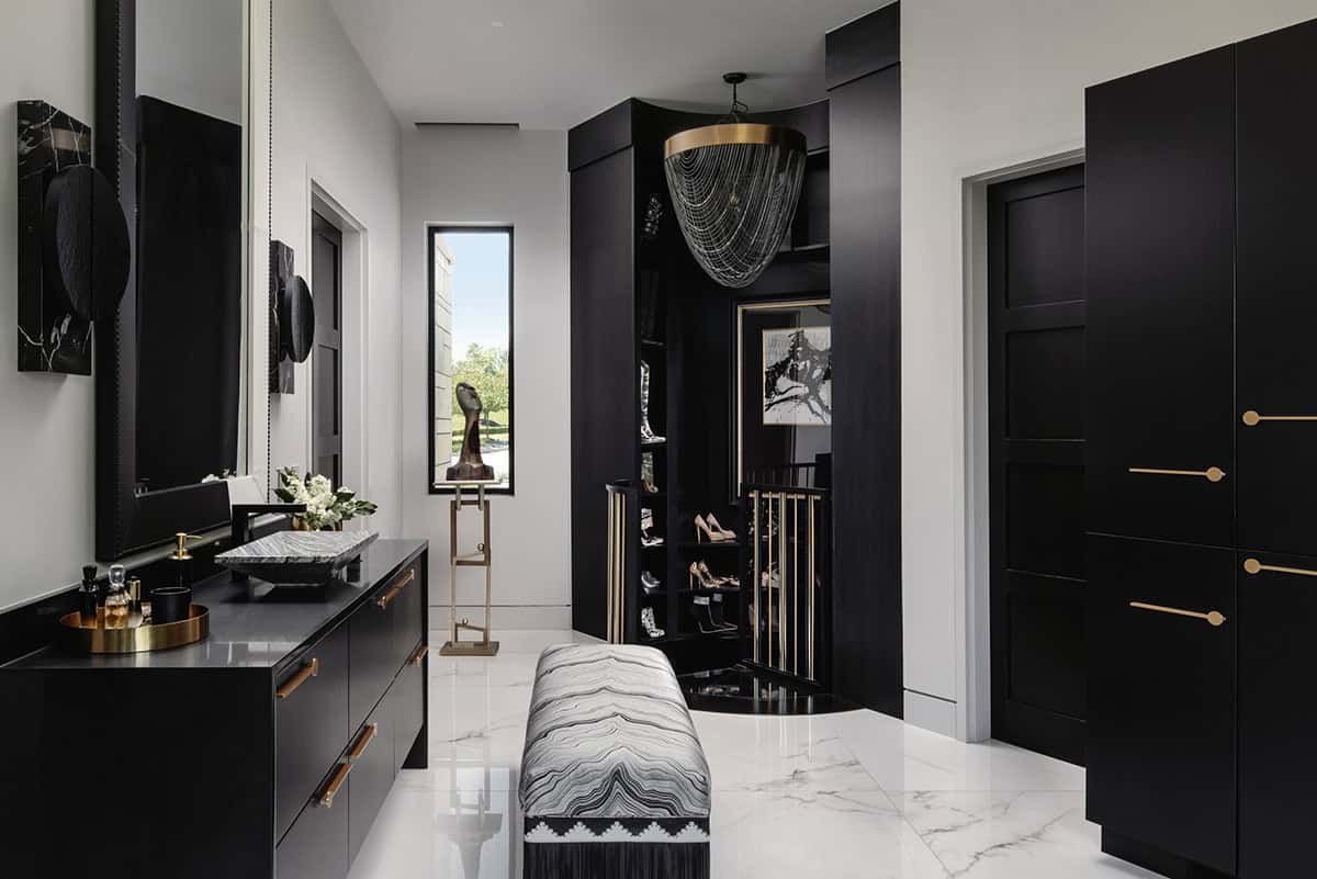 Black lacquer dressing room with marble vanity and glass shoe display