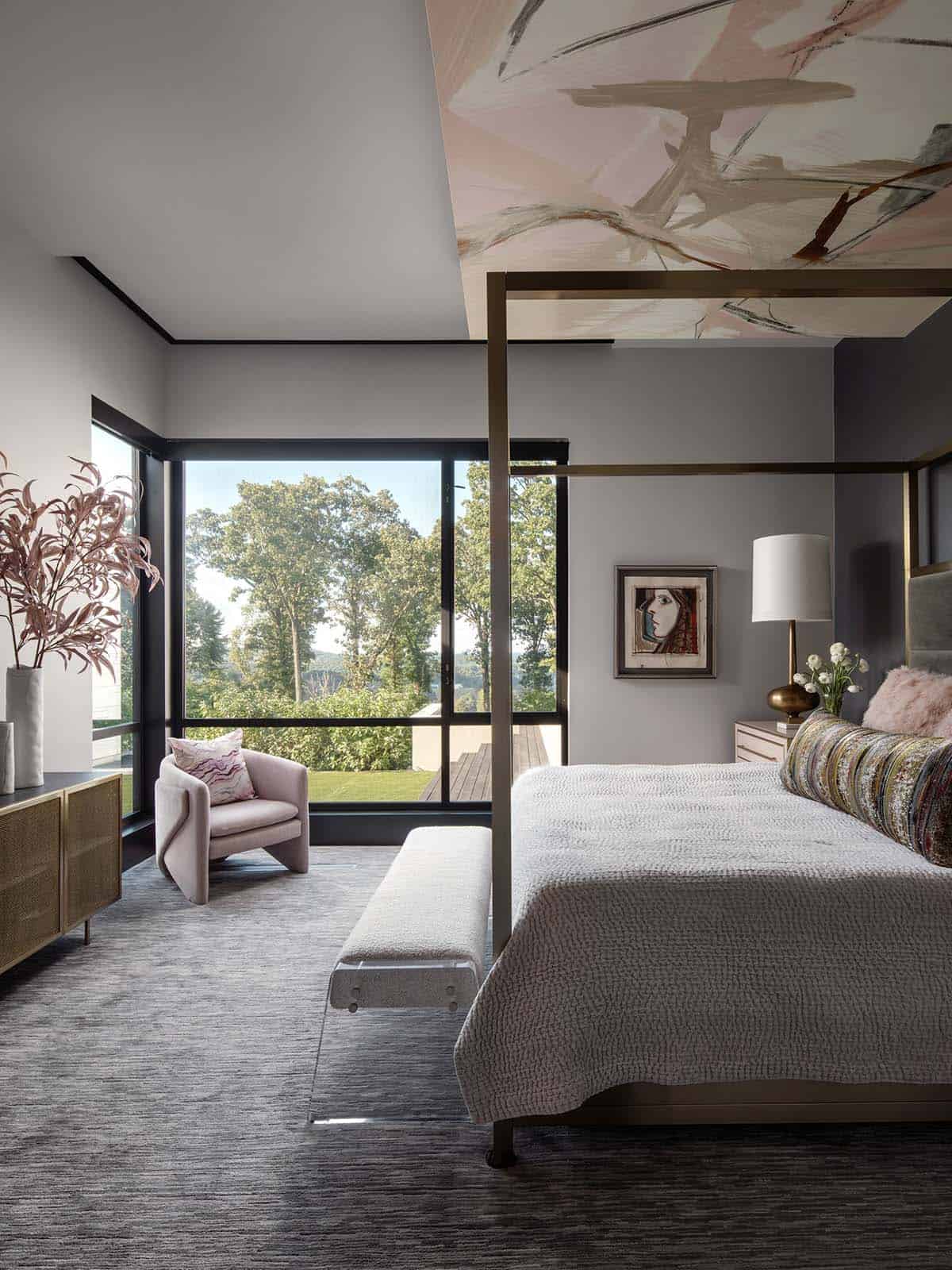 Primary bedroom with abstract painted ceiling and blush velvet accent chair