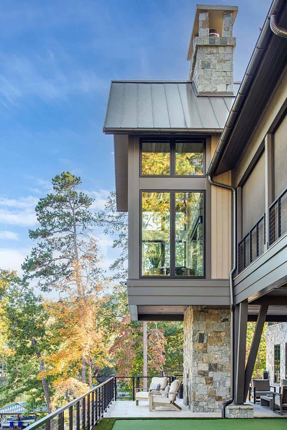 Exterior view of a cantilevered window bay supported by a stone column