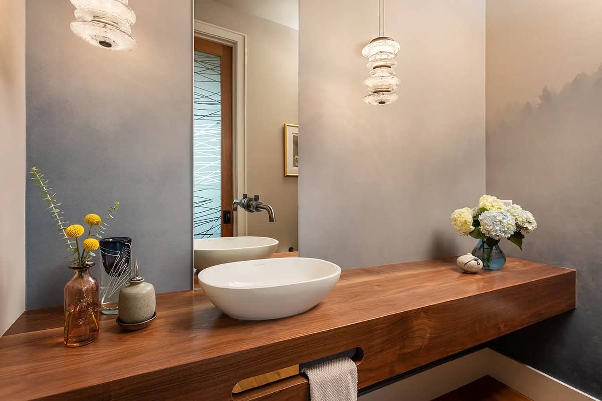 Powder room with wood floating vanity and vessel sink