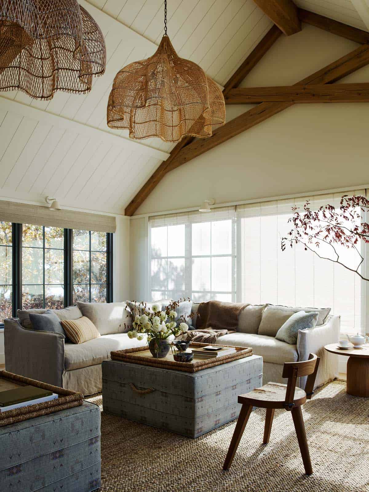 Living room seating area with woven pendants and vaulted ceiling beams