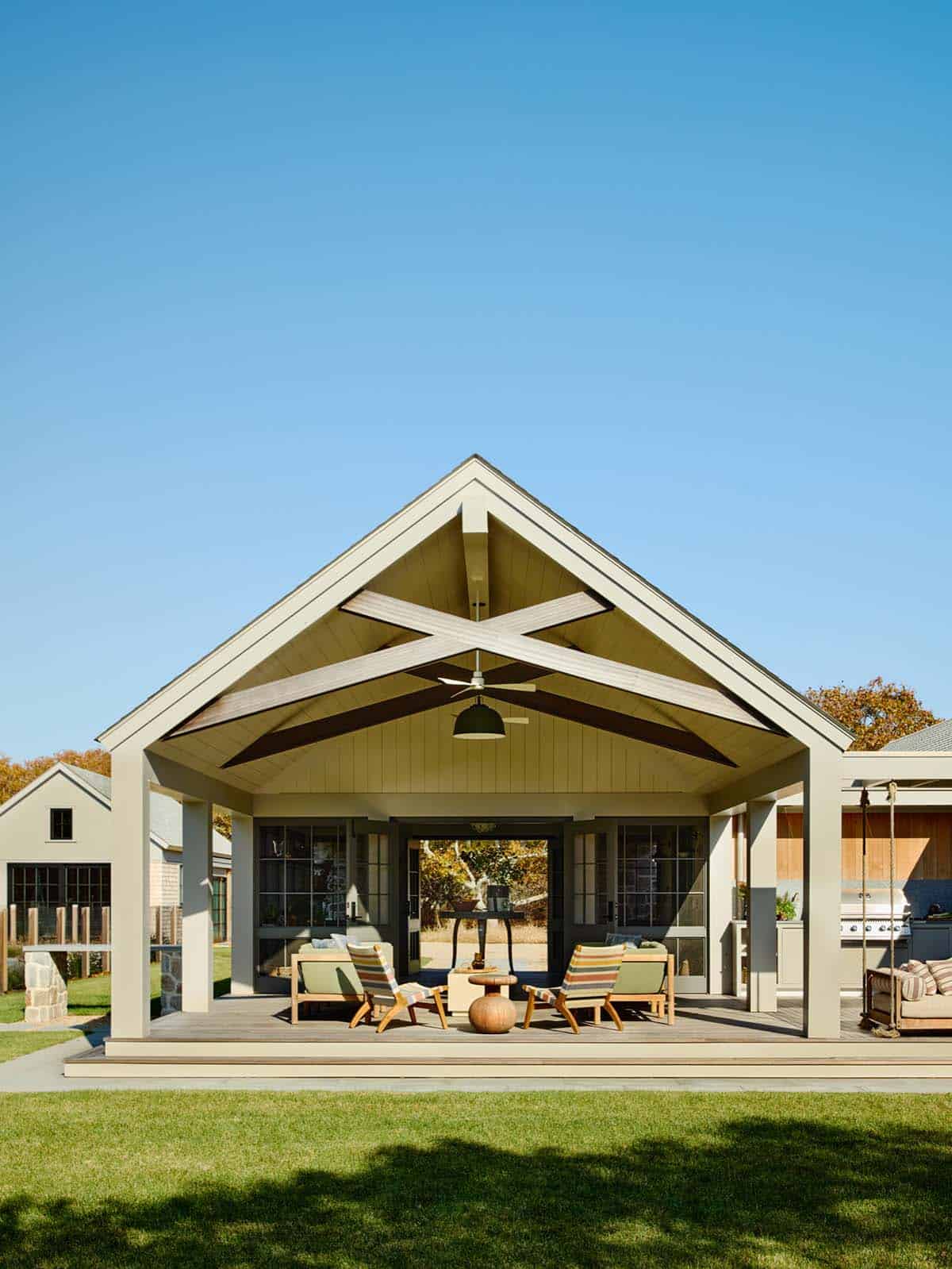 Gable-roofed pavilion with exposed beams and cross-braced ceiling detail