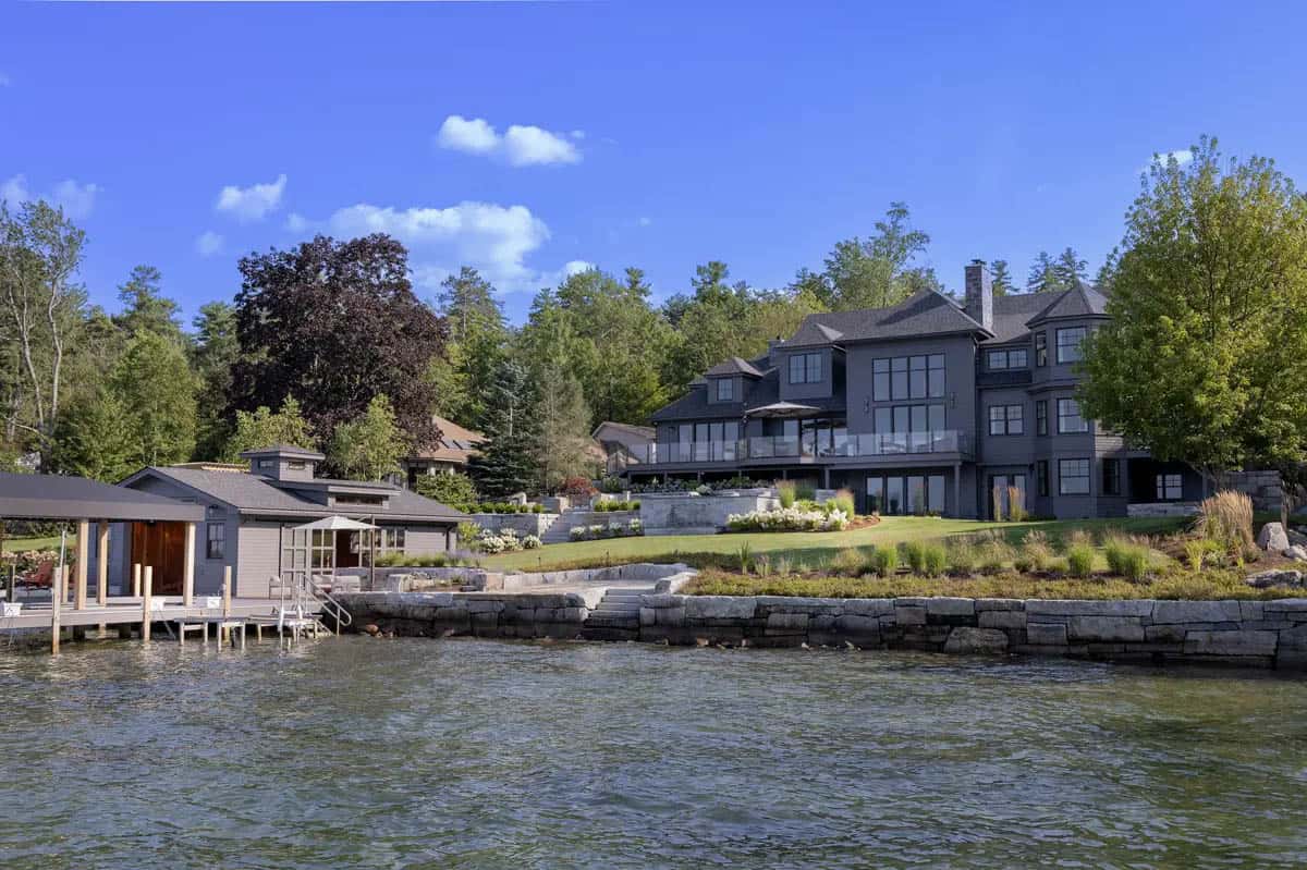 Waterfront view of the home and boathouse from the lake