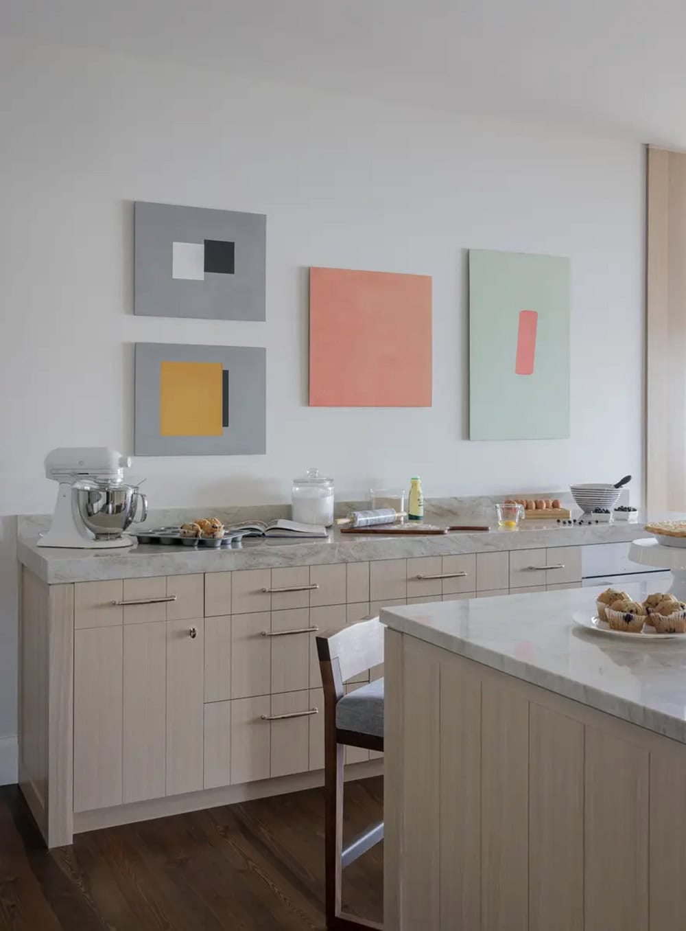 Baking counter with colorful abstract art and a stand mixer