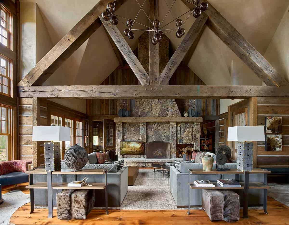 Rustic living room with vaulted wood beams and stone fireplace