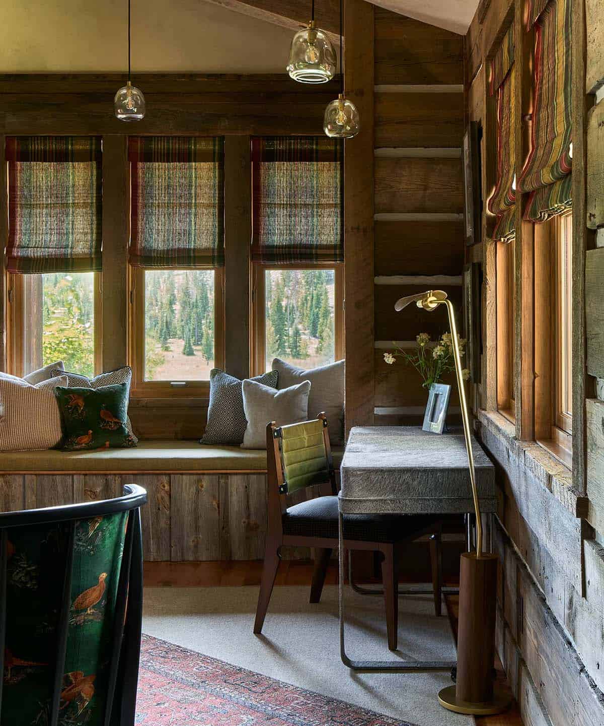 Window seat nook with plaid roman shades and nature views