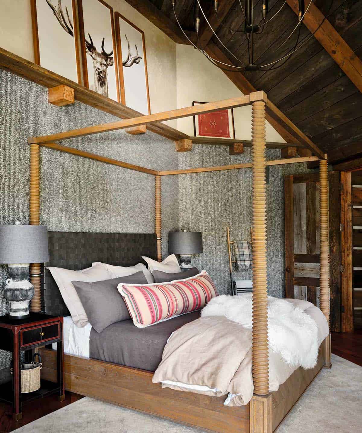Primary bedroom with canopy bed and antler artwork trio