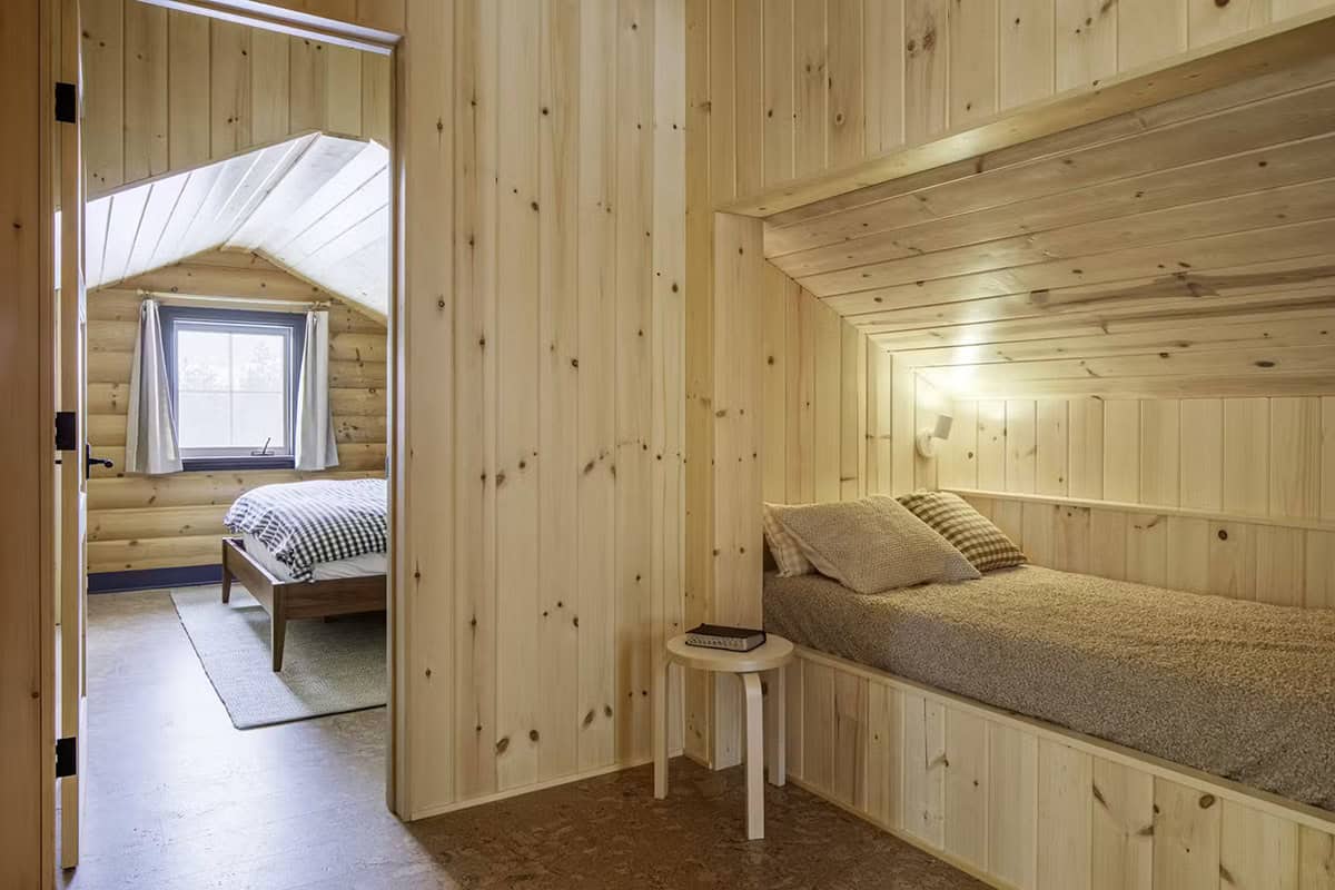 Built-in wood bunk nook next to bedroom doorway