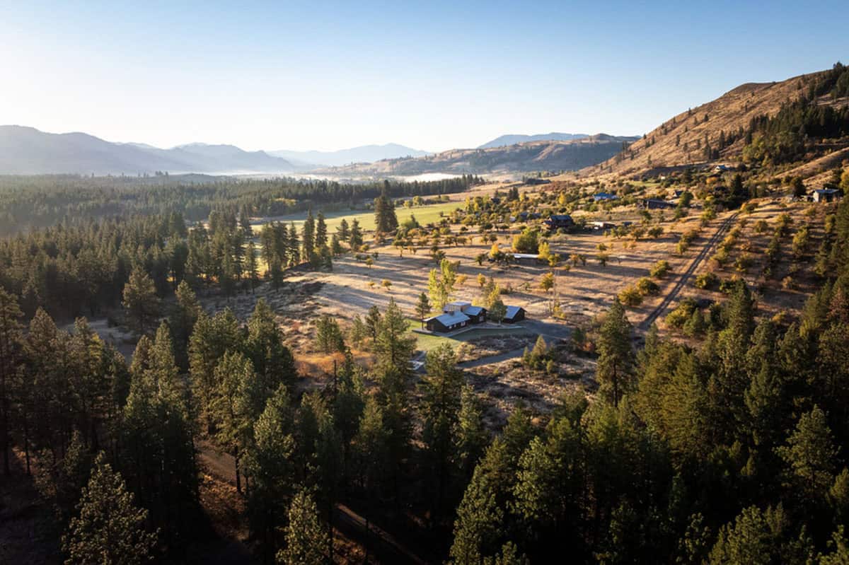 Aerial landscape view of Methow Valley with cabin set among trees and fields