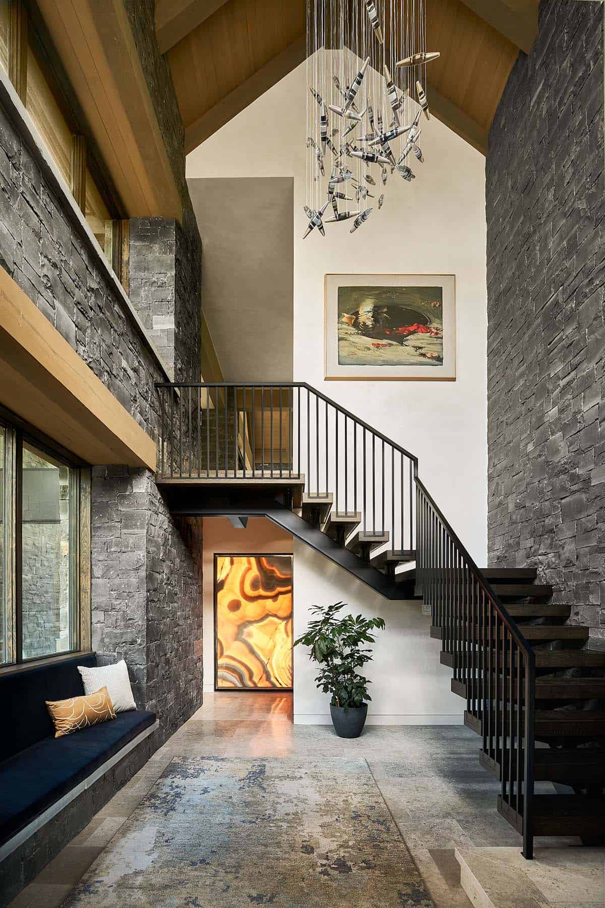 Staircase and entry hall with agate artwork lit from within under the stairs